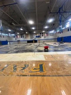 Large scale floor demolition performed on a gymnasium by DMI.