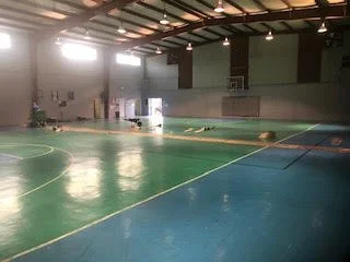 Large scale floor demolition performed on a gymnasium by DMI.