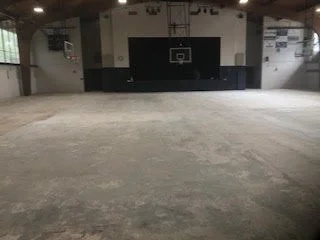 Large scale floor demolition performed on a gymnasium by DMI.