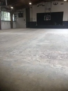 Large scale floor demolition performed on a gymnasium by DMI.