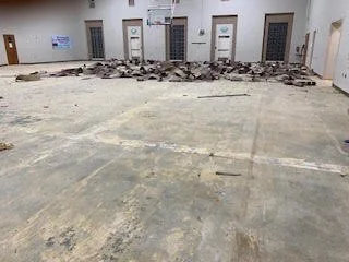 Large scale floor demolition performed on a gymnasium by DMI.