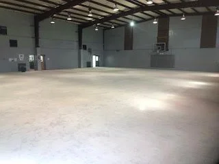 Large scale floor demolition performed on a gymnasium by DMI.