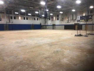 Large scale floor demolition performed on a gymnasium by DMI.