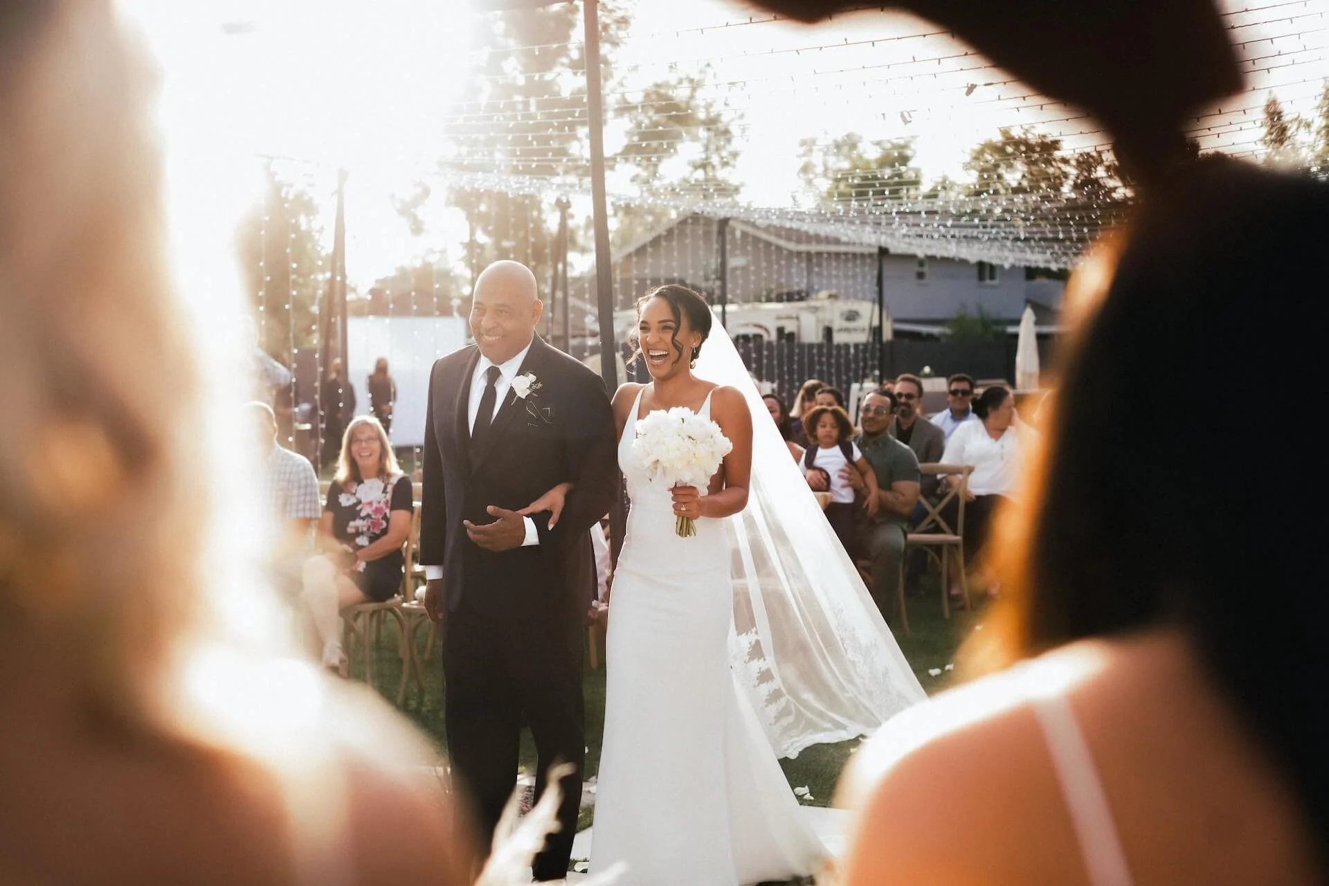 Wedding father and bride walking down aisle