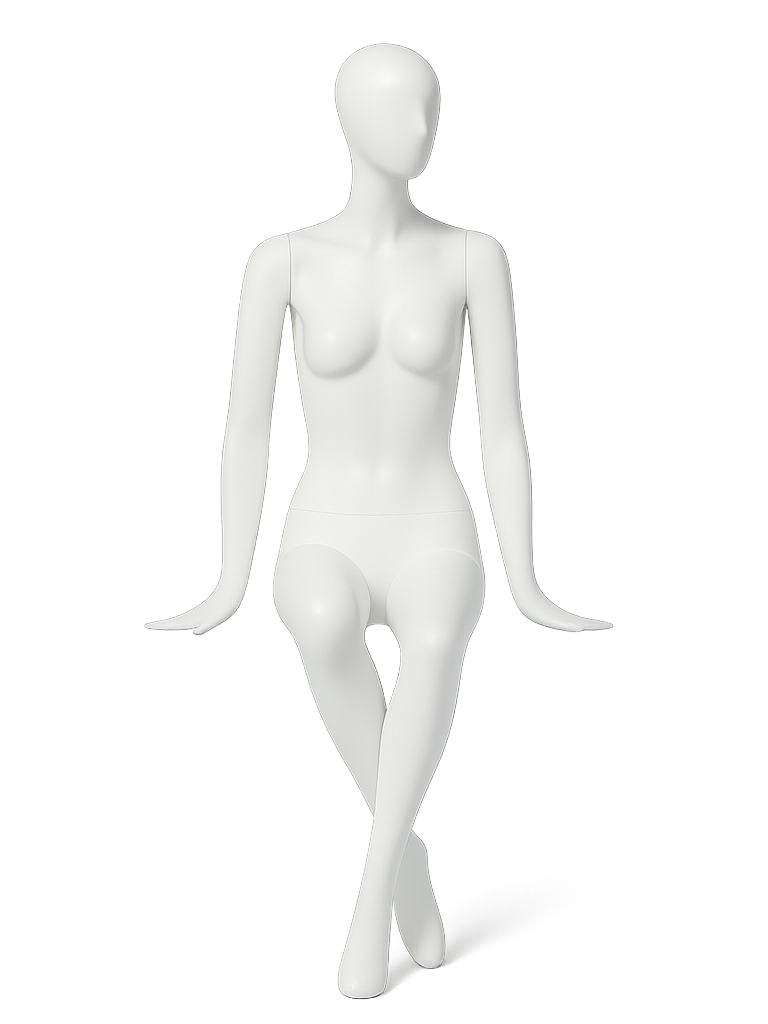 White female mannequin seated with legs crossed and hands resting beside the hips on a plain background.