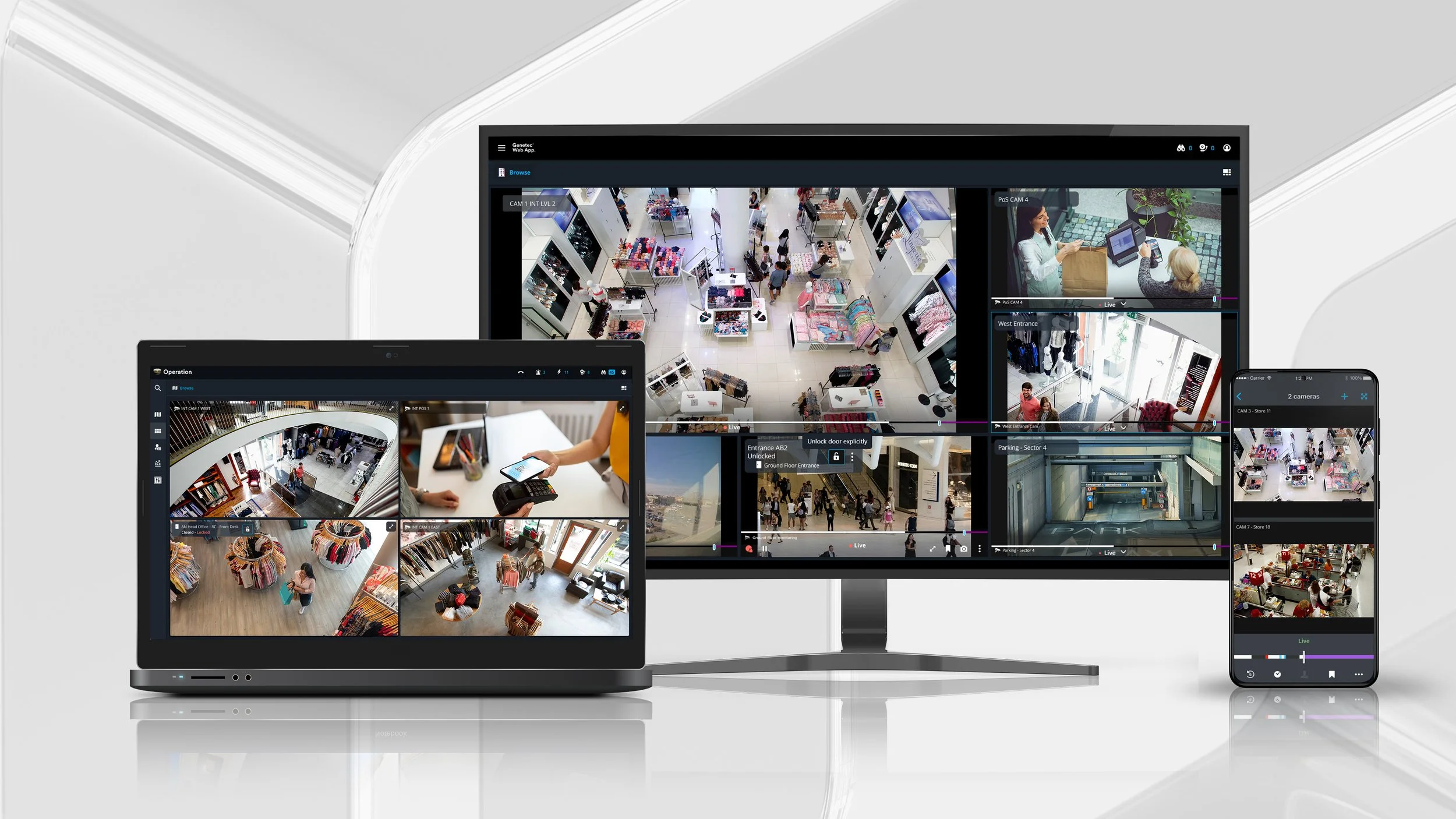 Screens showing security camera footage in a shopping mall, displaying interior views of stores, escalators, and entrance areas.