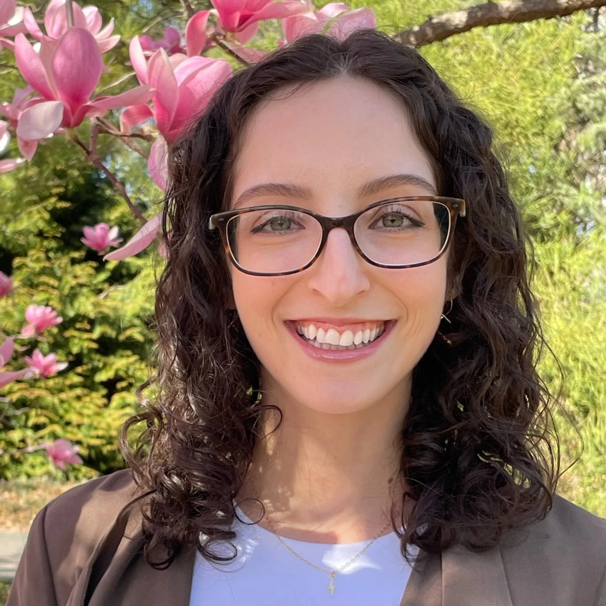 Adina Babad, a therapist for perfectionism in Garden City, NY, smiling outdoors