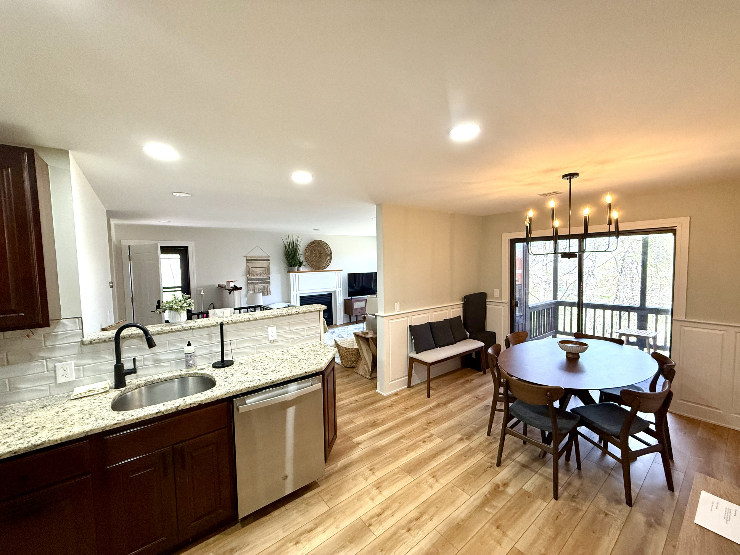Open space view from kitchen to from door and living room