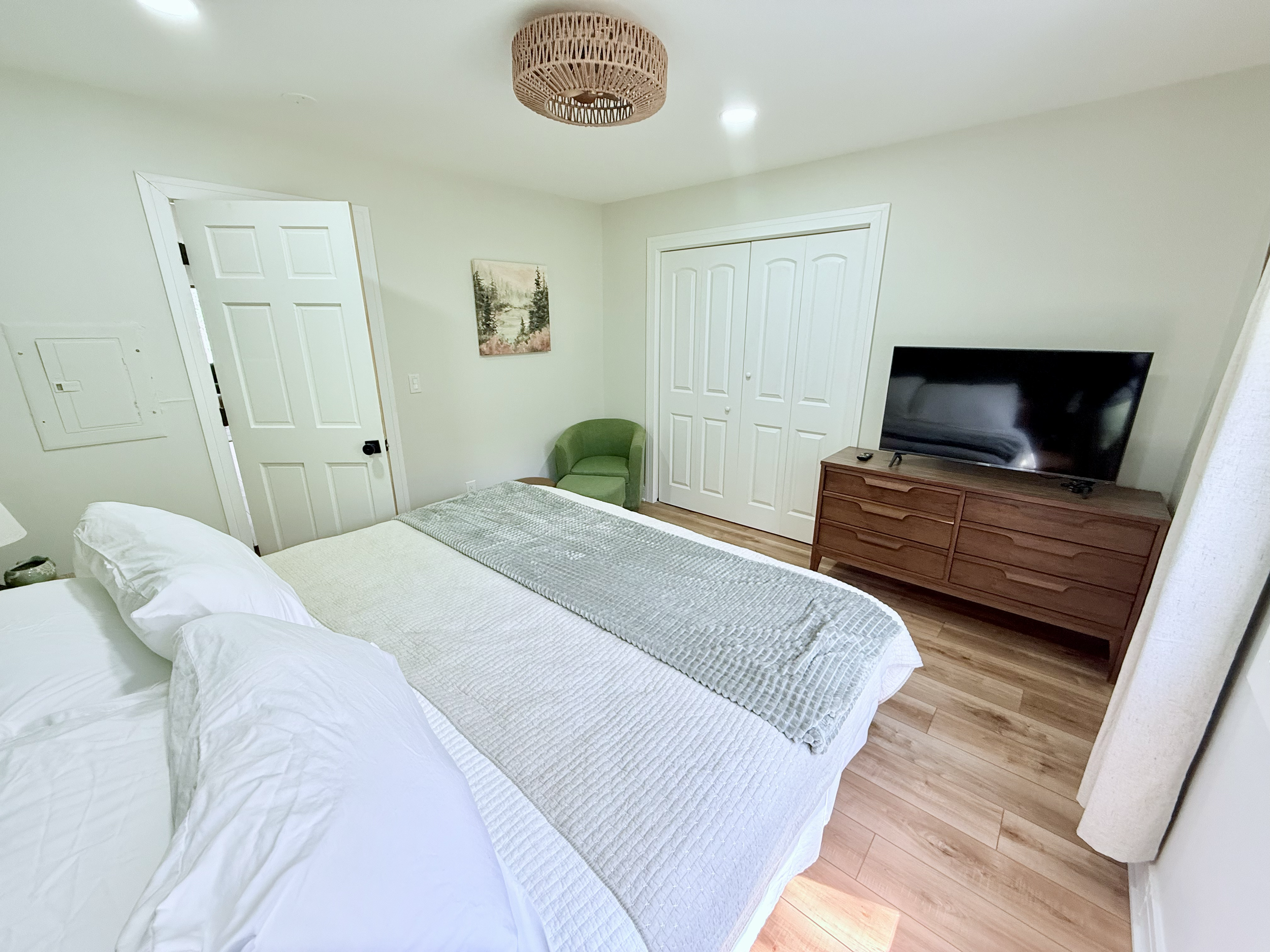 Main floor master with king bed adjacent to bathroom