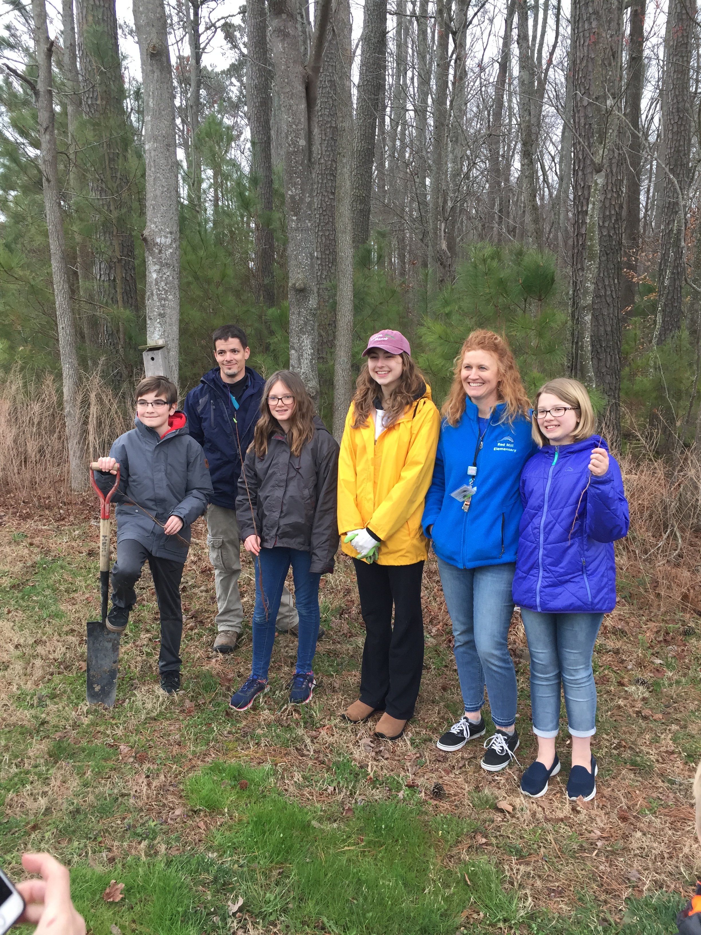 Posing with elementary students during our planting