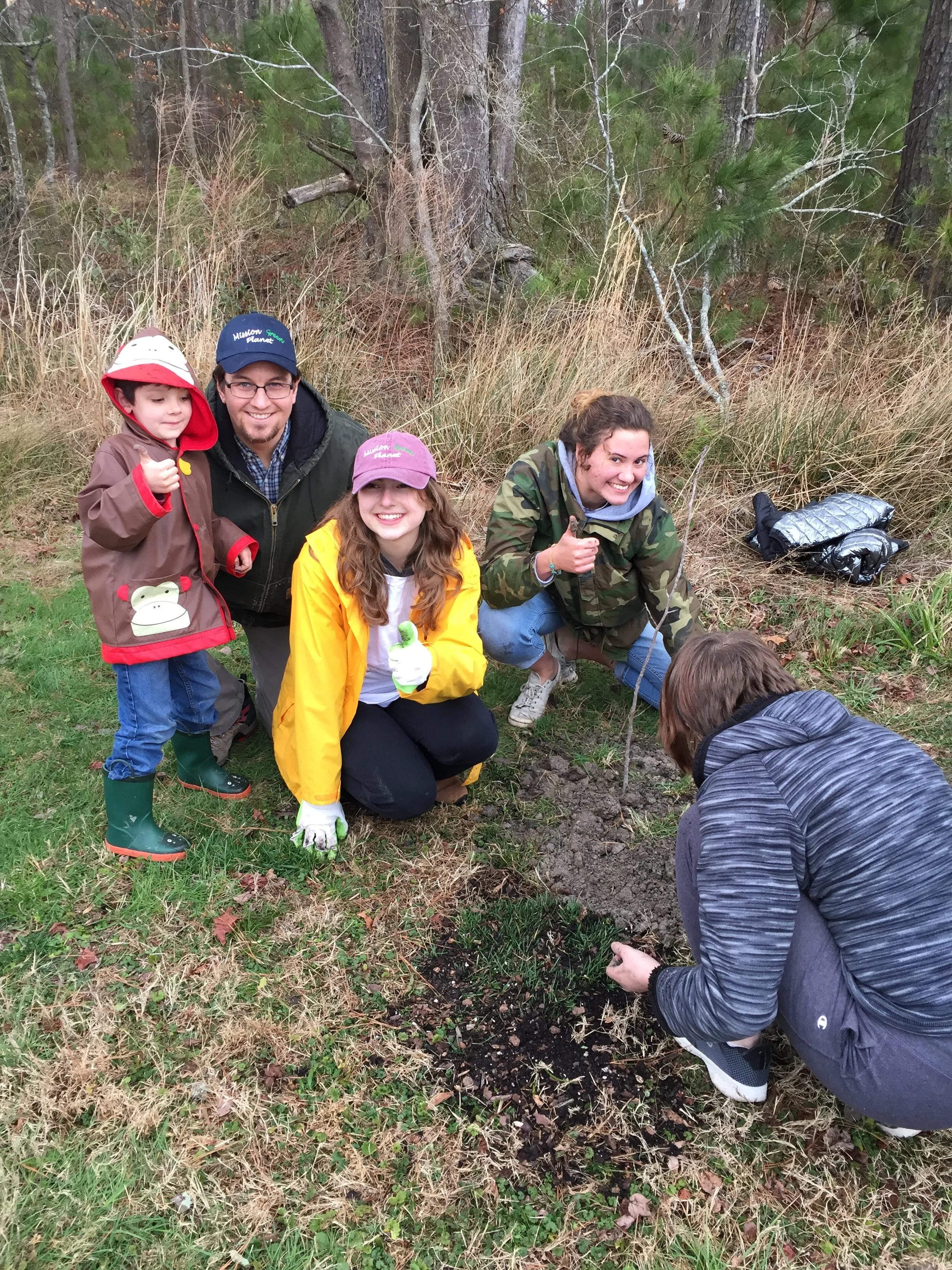 Planting trees with mentor Chris Freeman, his kids, and fellow students