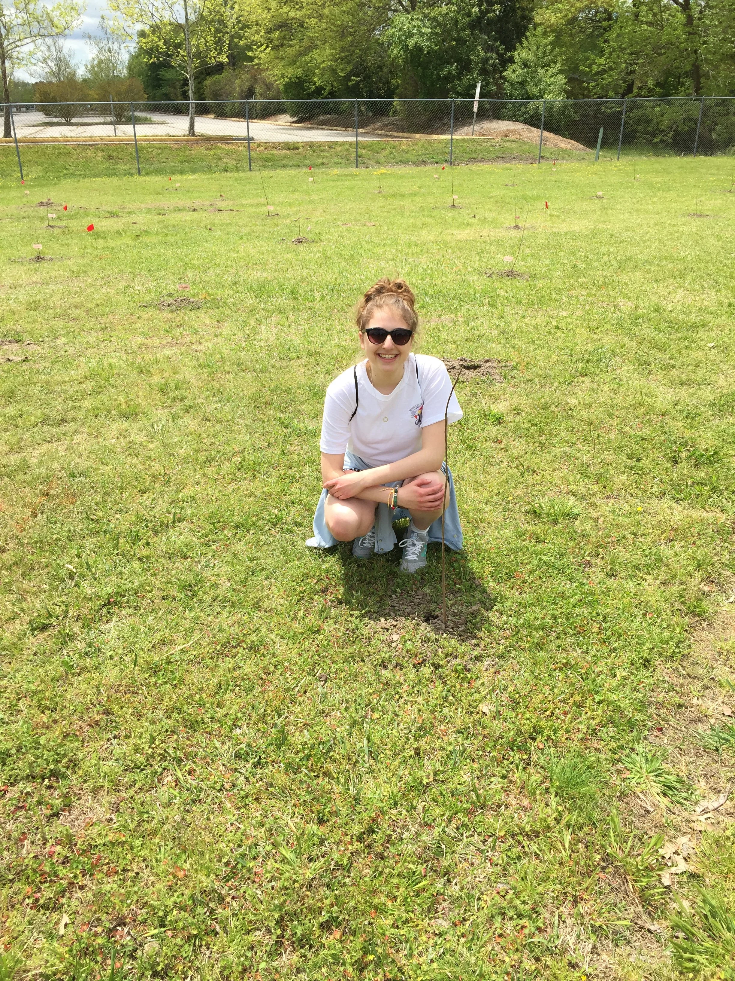 Sitting with the first sapling planted on Earth Day
