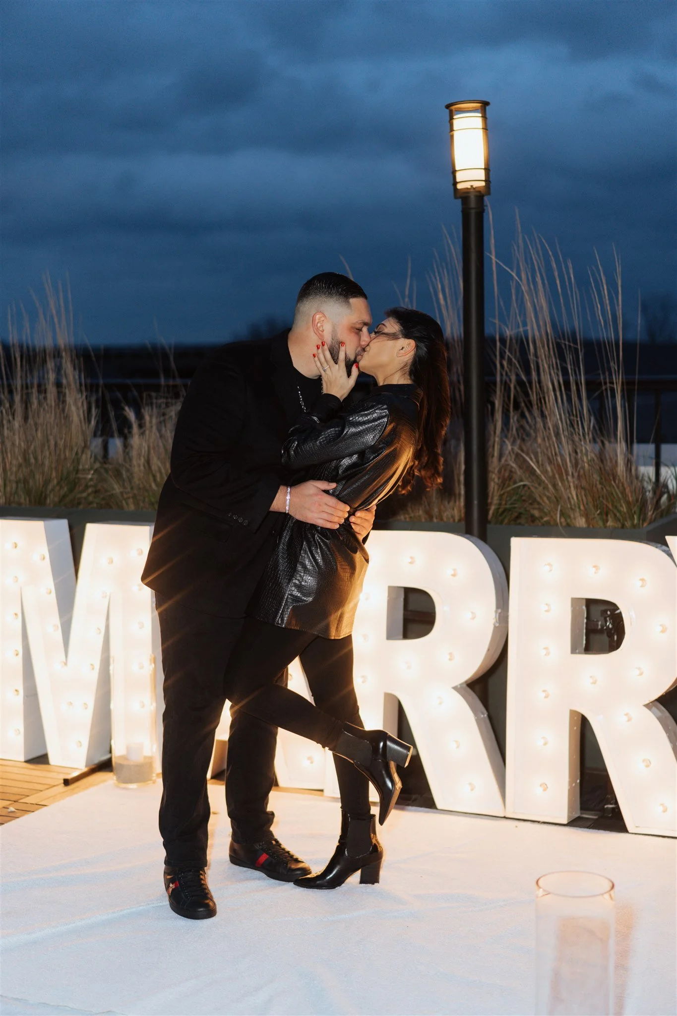 Emotional rooftop proposal in NYC with skyline