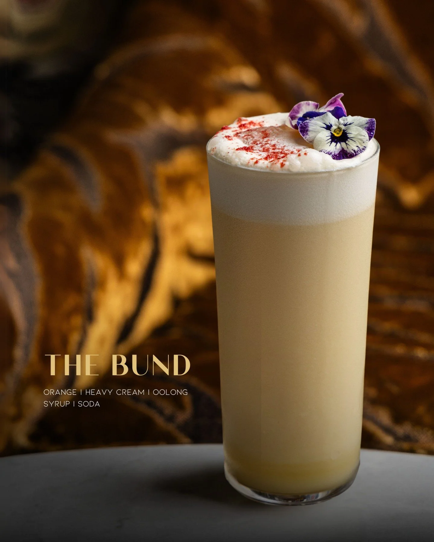 Who knew a mocktail could look this pretty? Introducing our Signature Mocktail - 𝐓𝐡𝐞 𝐁𝐮𝐧𝐝, inspired by Shanghai&rsquo;s iconic riverside spot, this creamy mocktail is a taste of tradition with a modern twist🍸️⁠
⁠
Crafted with 𝘖𝘳𝘢𝘯𝘨𝘦 | ?