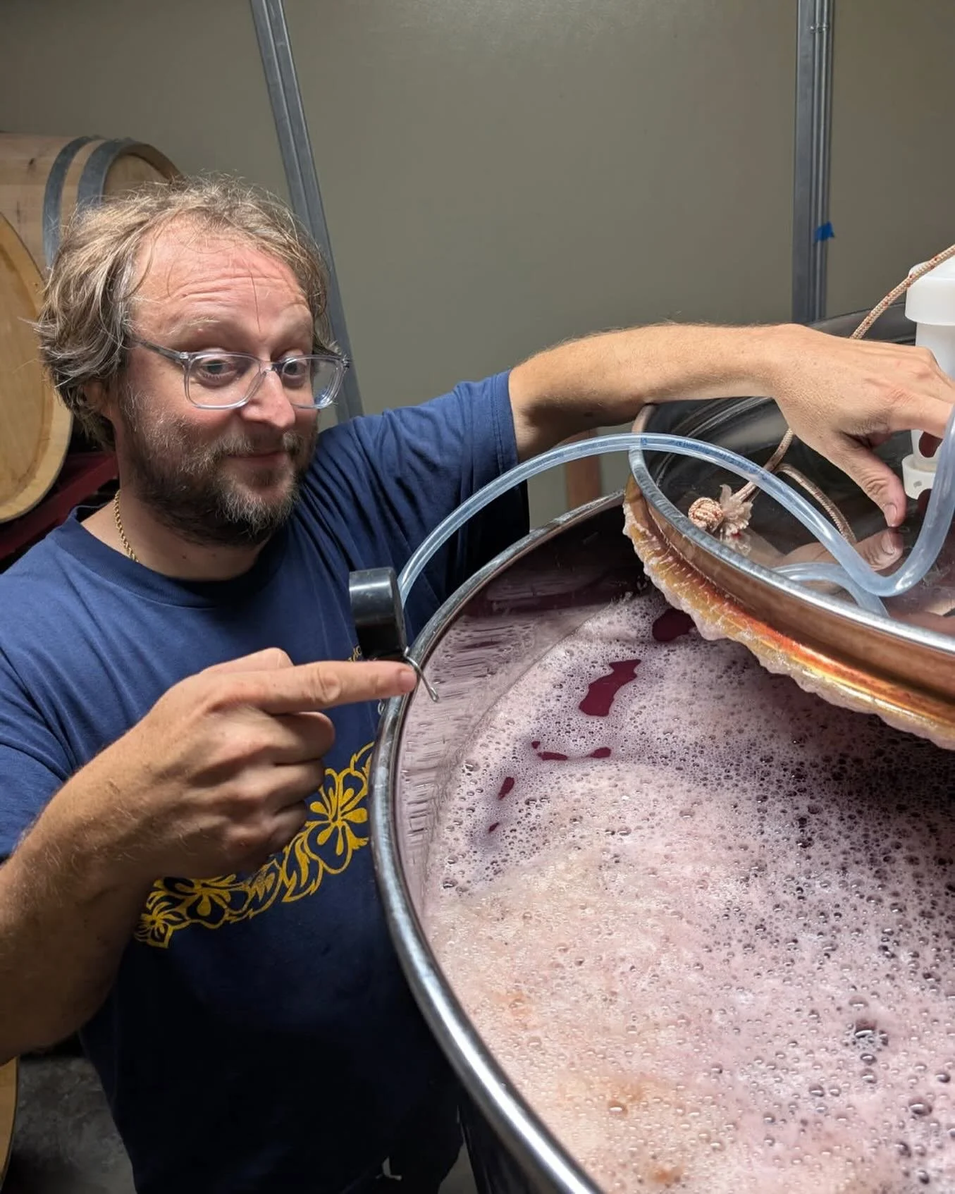 A picture too good not to share.  Our resident winemaker / mad Hungarian showing off the ros&eacute; tank!