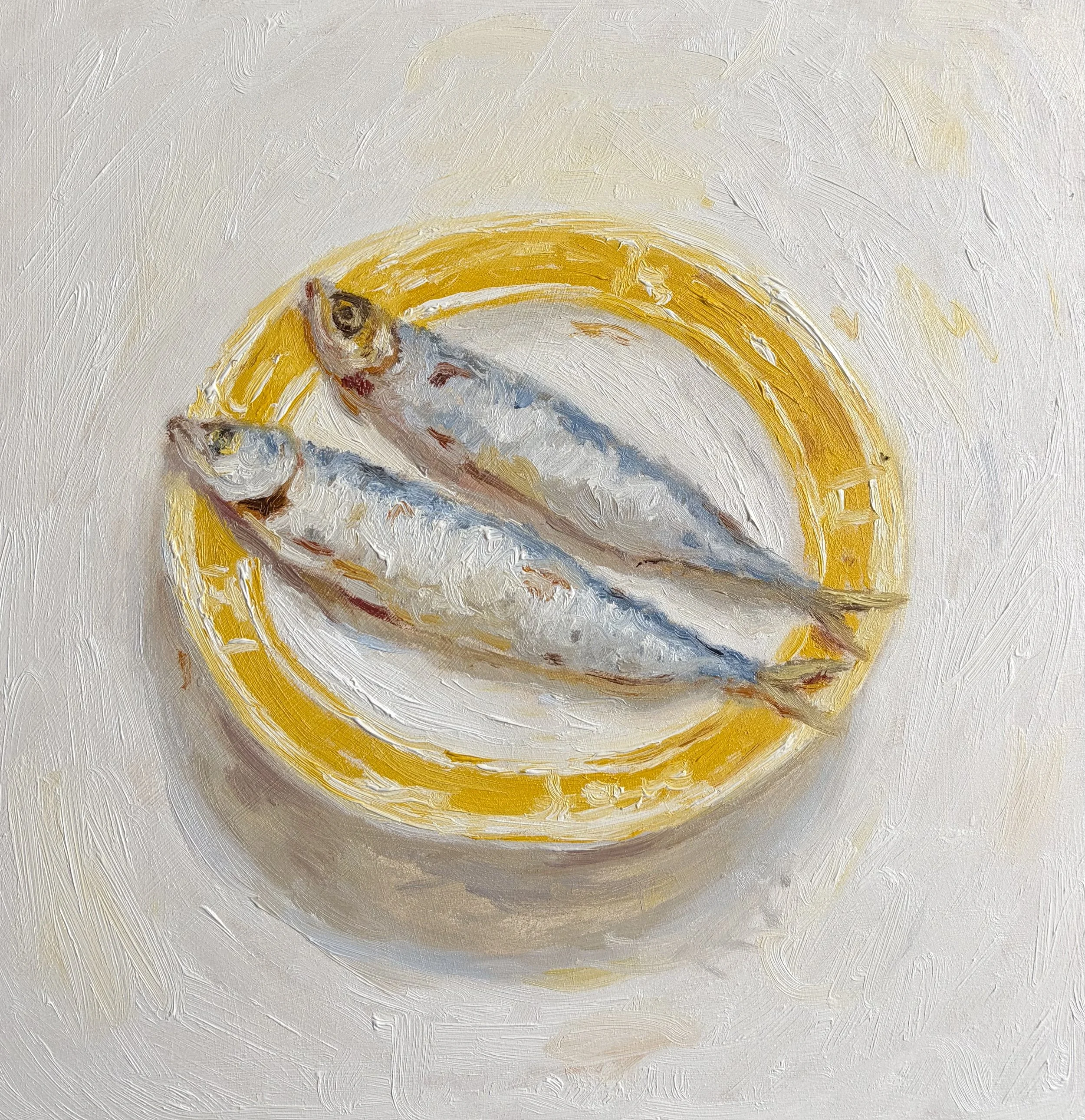 Sardines on a yellow plate