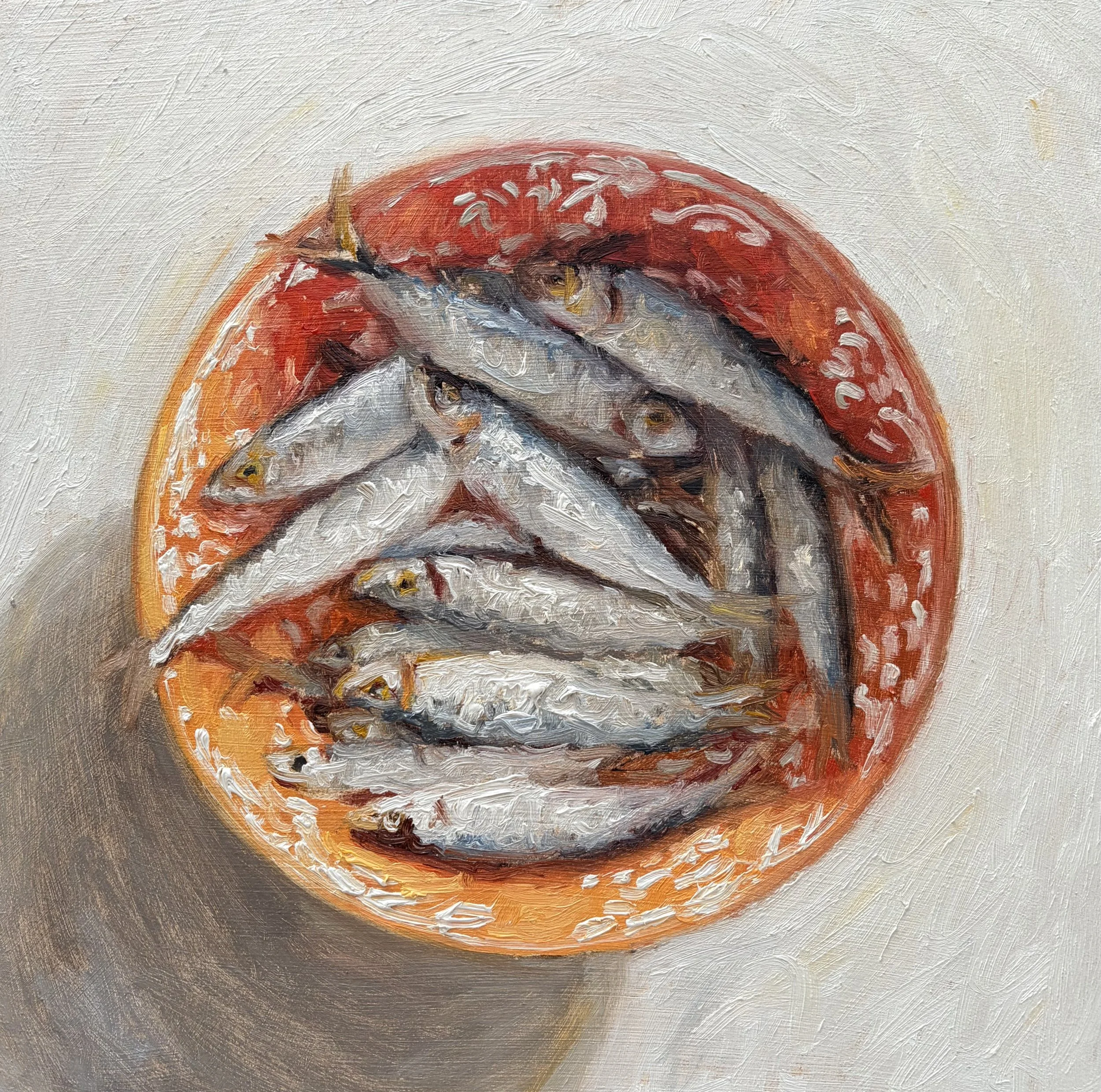 Orange bowl full of sprats