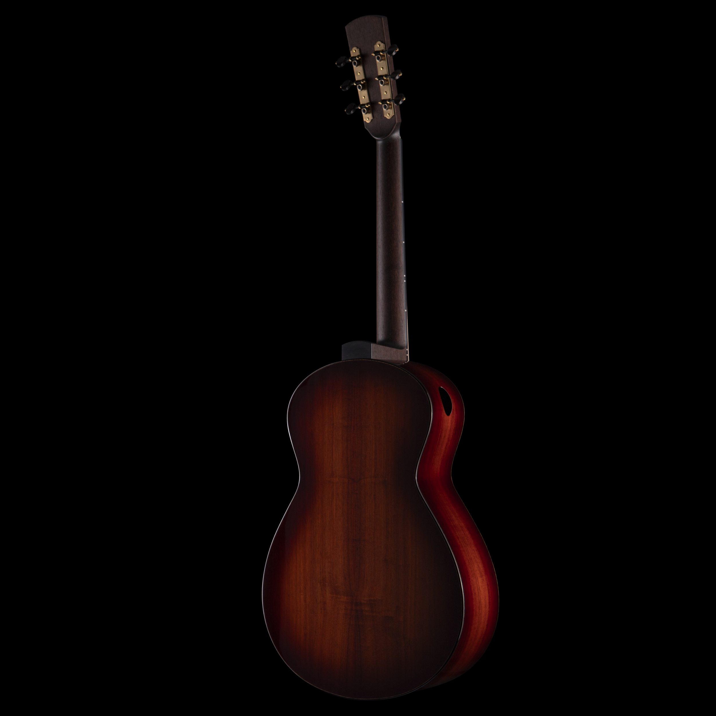 Close-up of a classical Dion guitar's headstock and tuning pegs against a black background