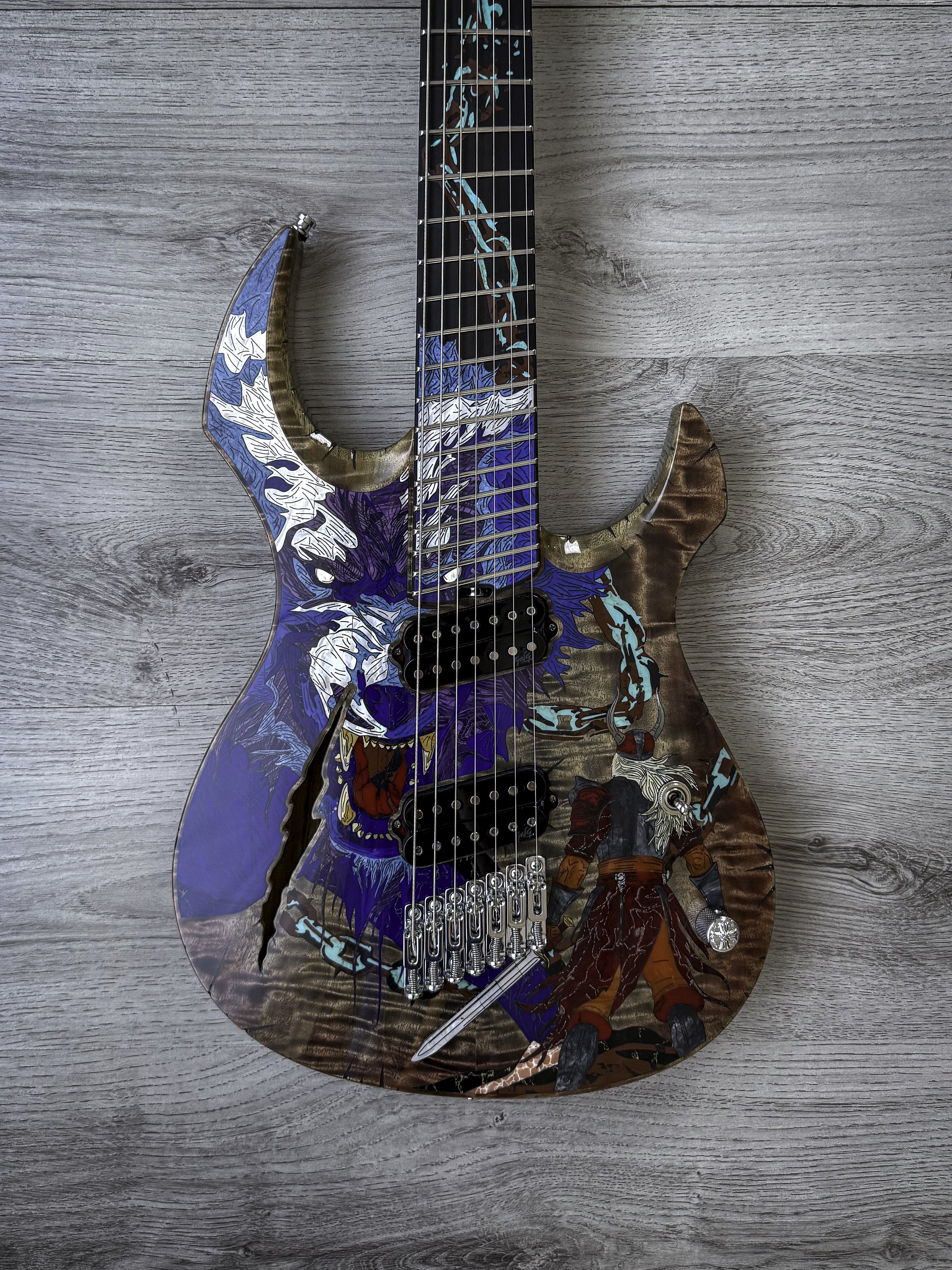 GNG Giulio Negrini electric guitar with a painted design featuring a warrior and a mythical creature, with the headstock and fretboard also decorated with artistic patterns.