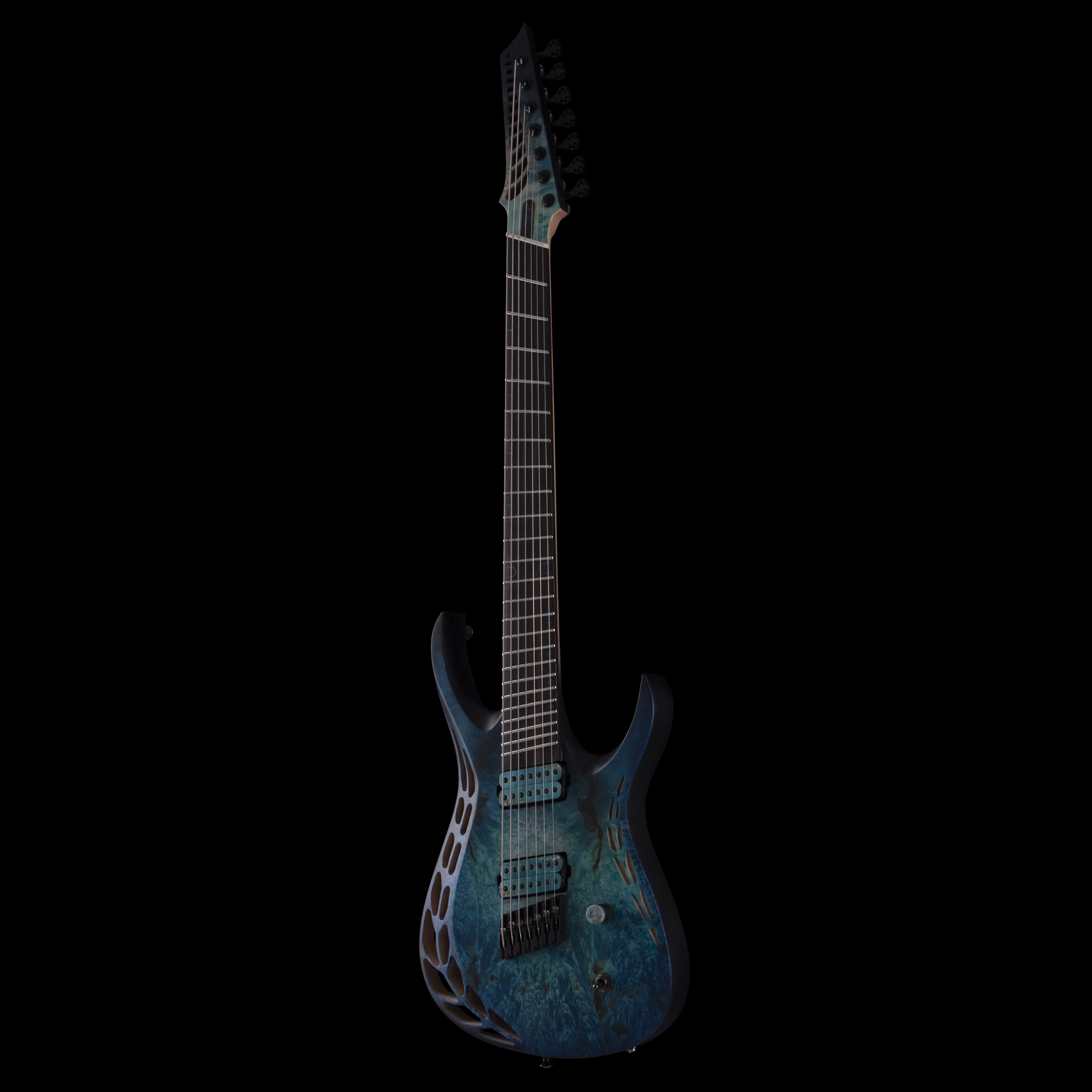 An electric OD guitar with a unique, artistic design on its body and a black headstock and neck, set against a black background.