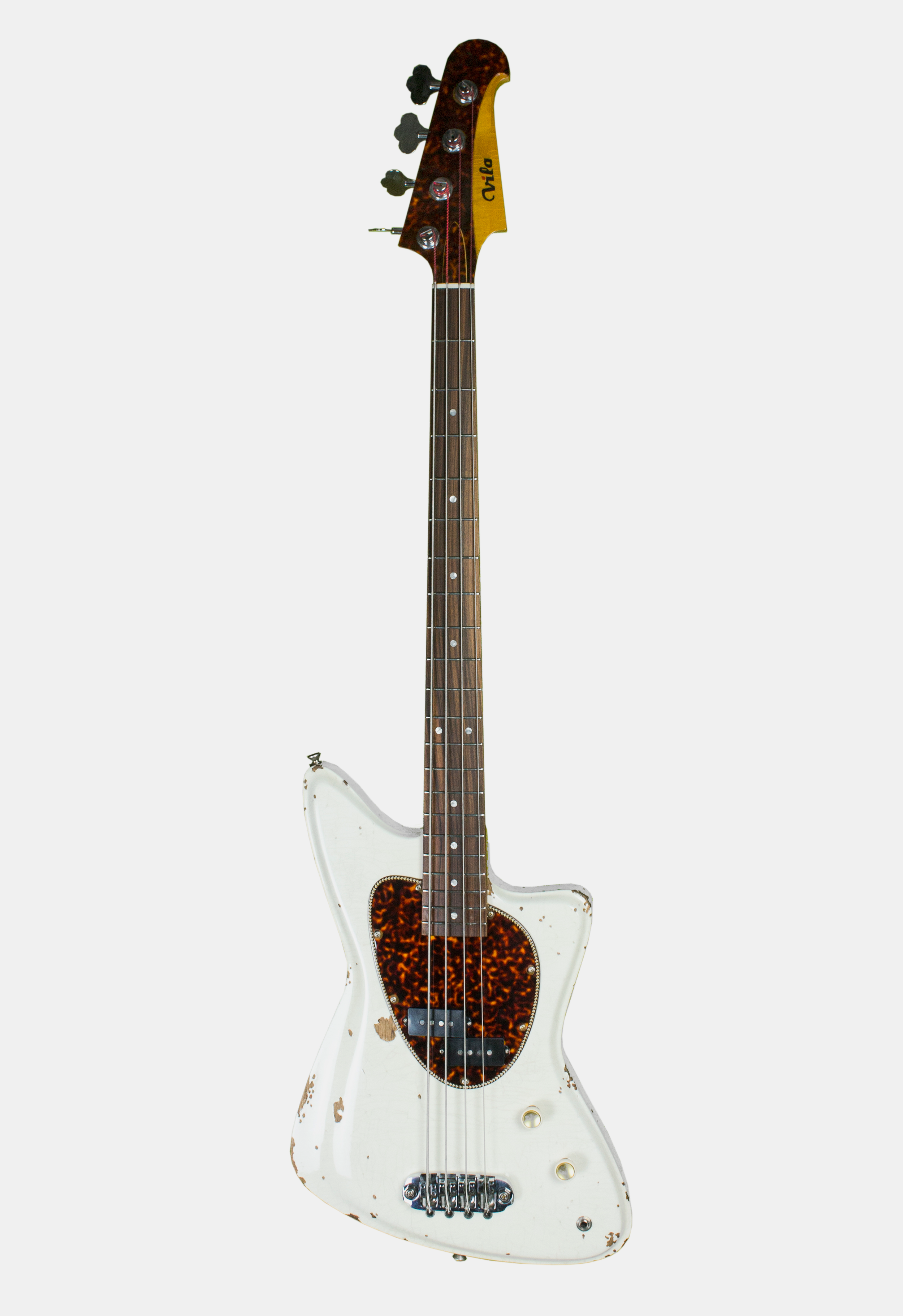 A vintage white electric Diego Vila bass guitar with a tortoise shell pickguard and distressed finish, against a plain background.