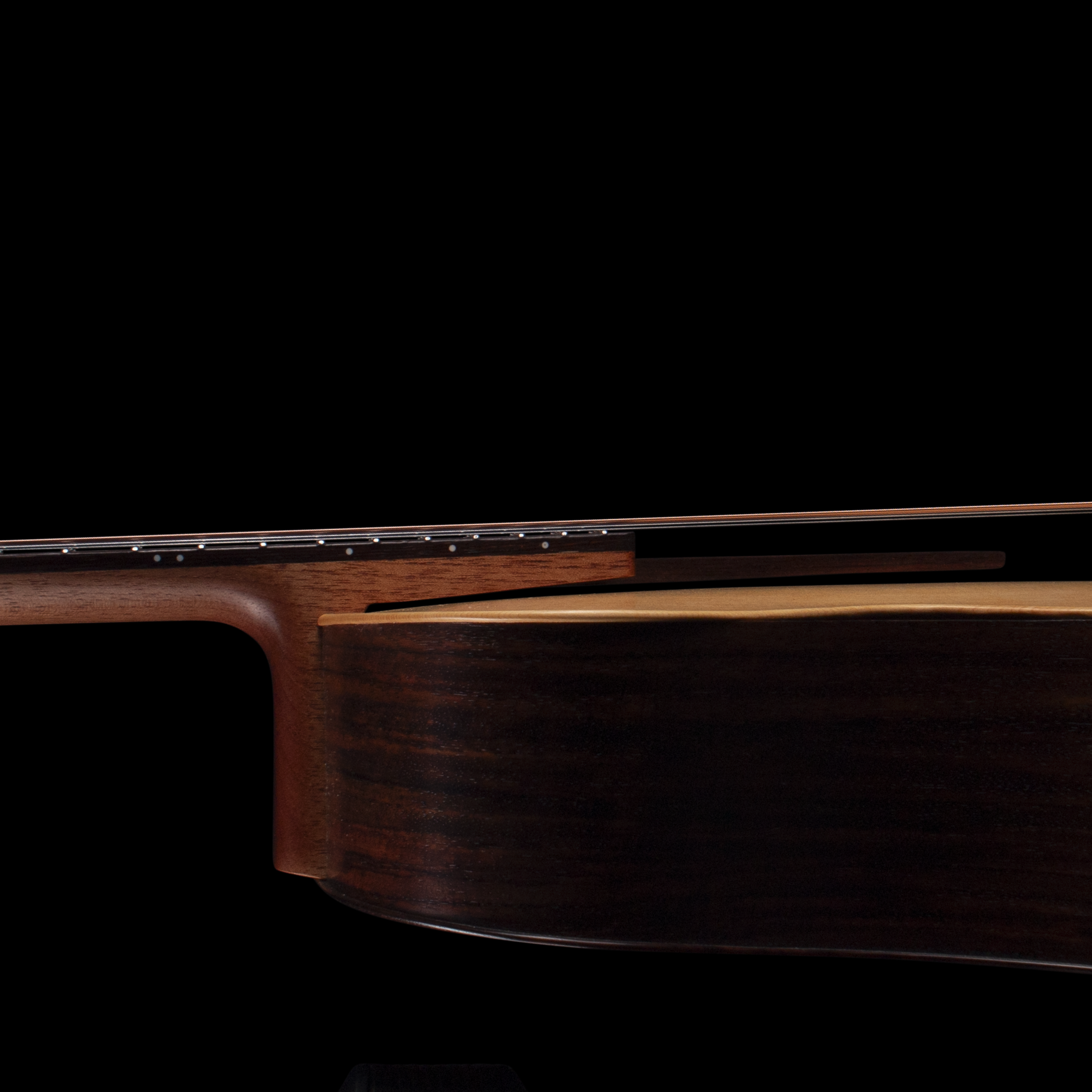 A close-up of a wooden Sankey guitar.