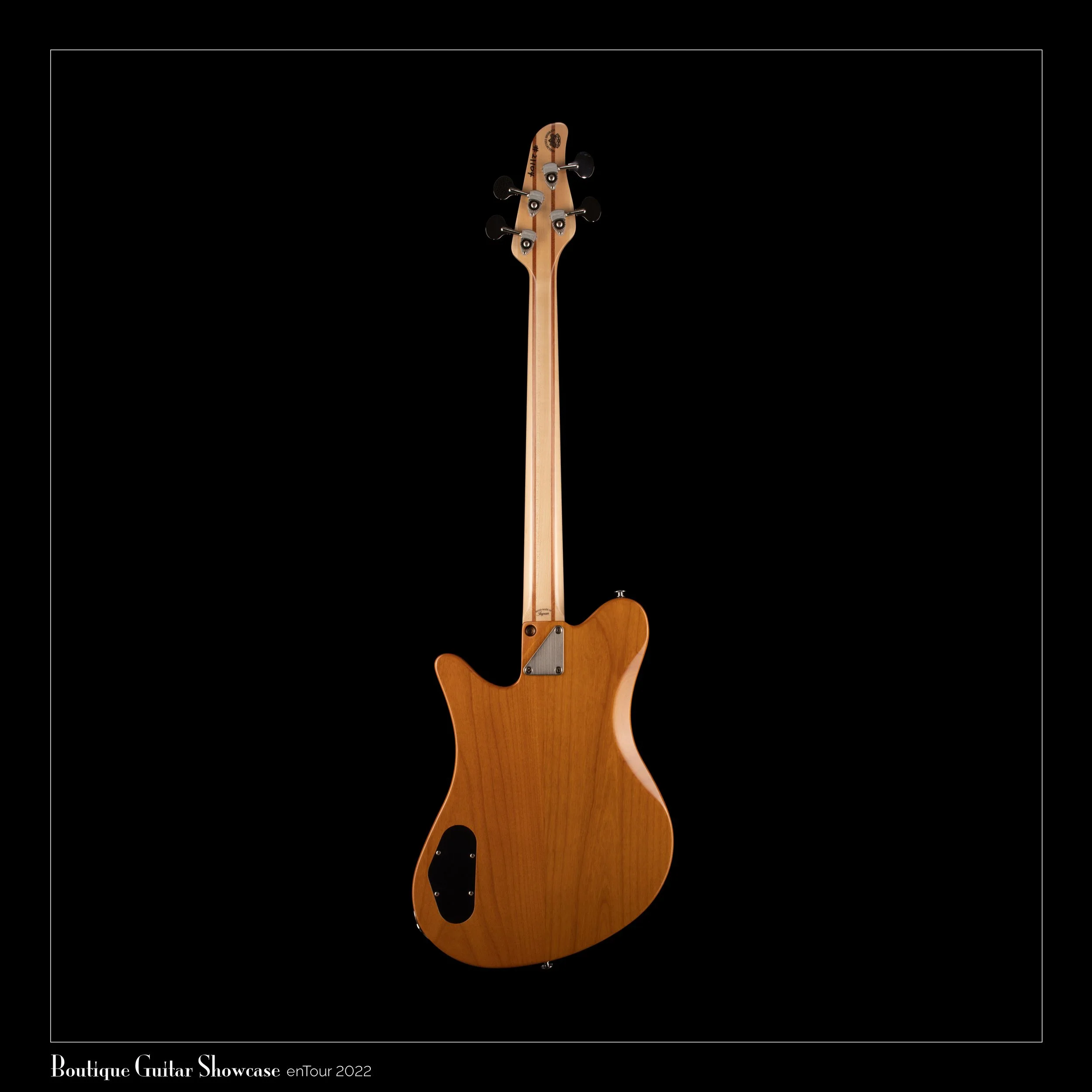 Back of a tan-colored OOPEGG electric guitar against a black background, showing the neck and body from behind.