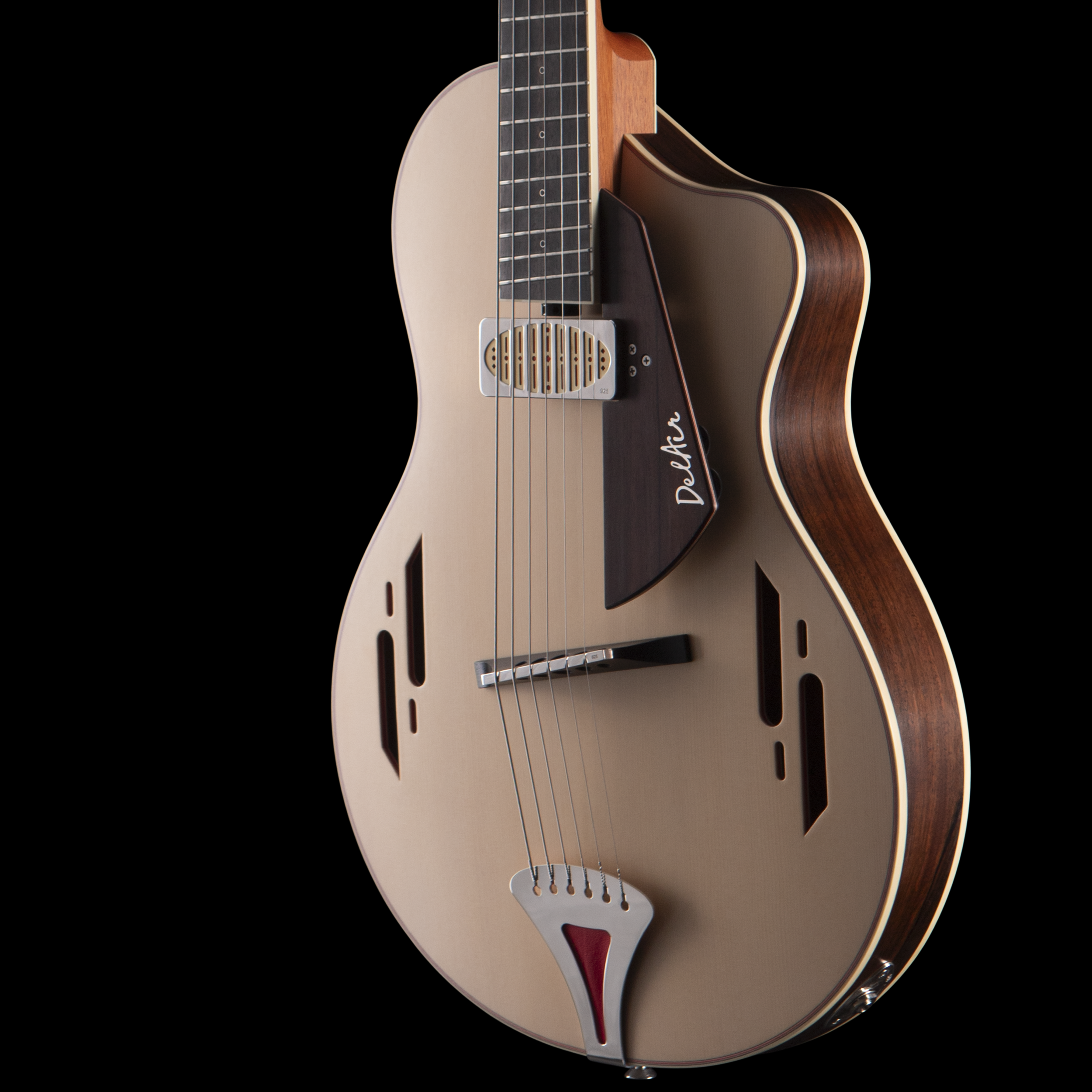Close-up of an Island Instrument electric guitar with a wooden body, metallic strings, and a natural finish, set against a black background.
