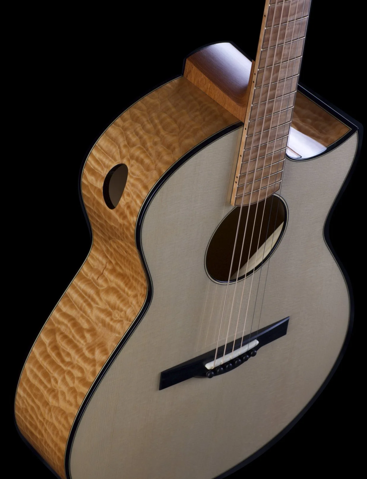 Close-up of a Dion acoustic guitar with a quilted maple top, a light-colored wood body, and a wooden fretboard, set against a black background.