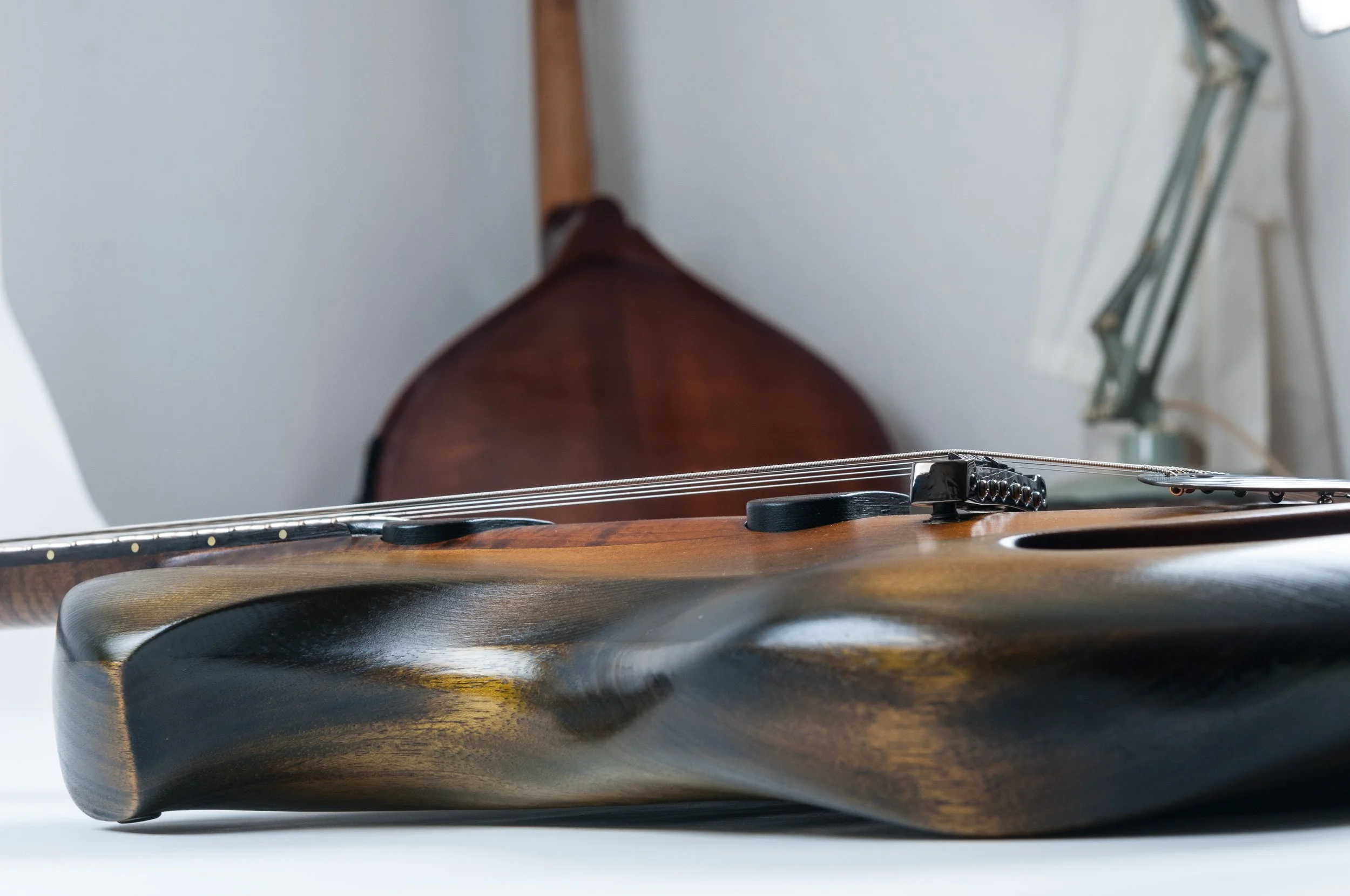 Close-up of an Ergon guitar lying on its side