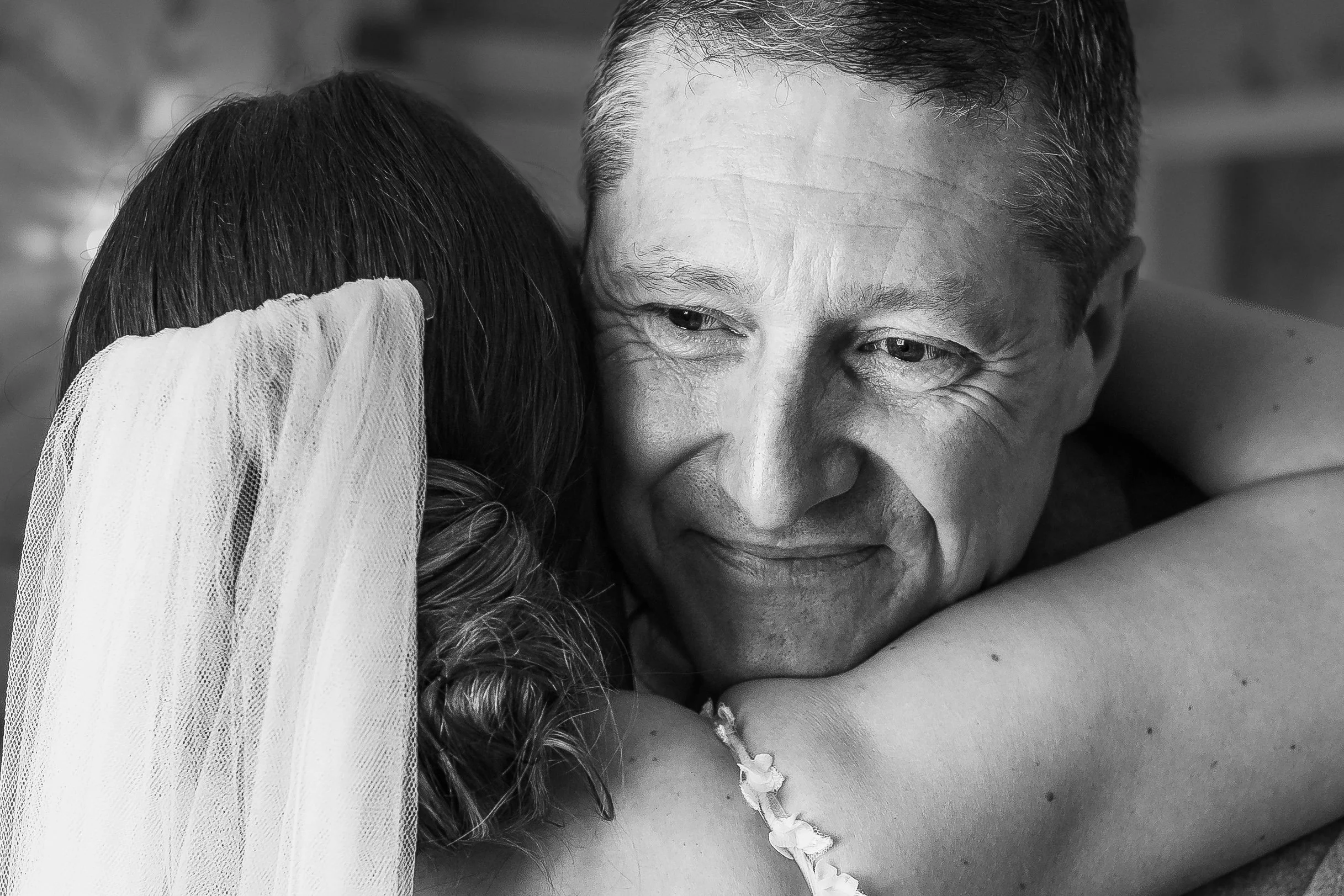 Bride hugging her father during first look at Combermere Abbey