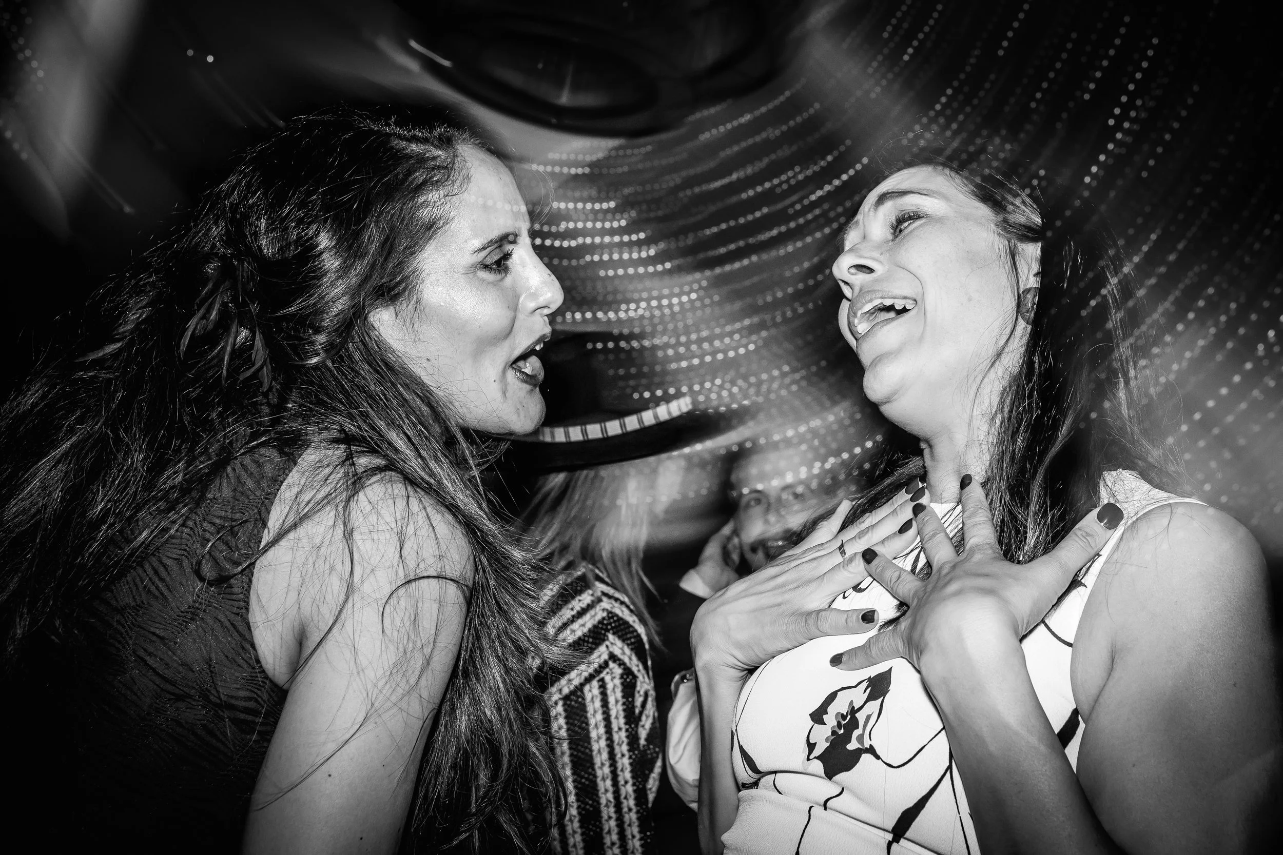 Guests dancing and laughing on the dance floor at a private party in Cheshire photographed by event photographer Sasha Morgan