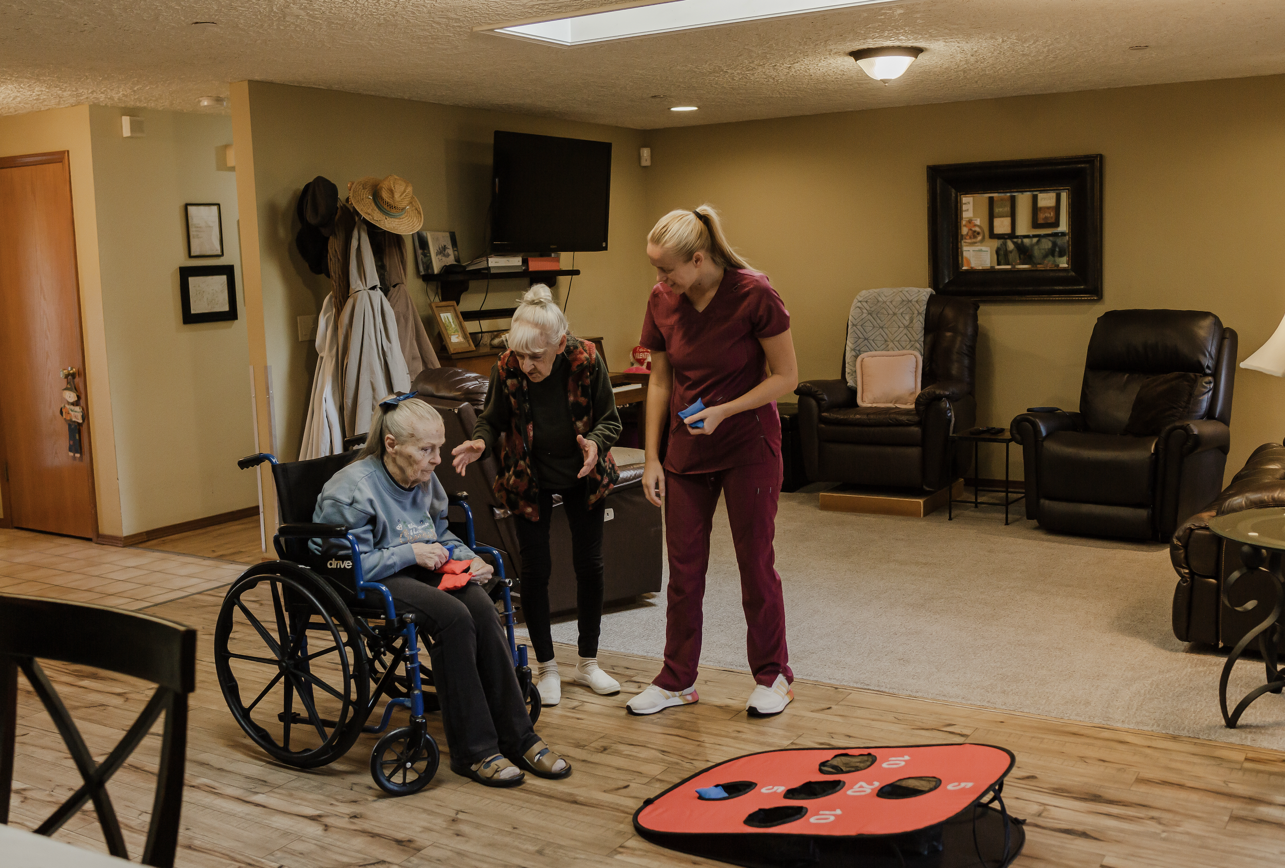 Sherwood Adult Family Home Residents playing games with our staff.