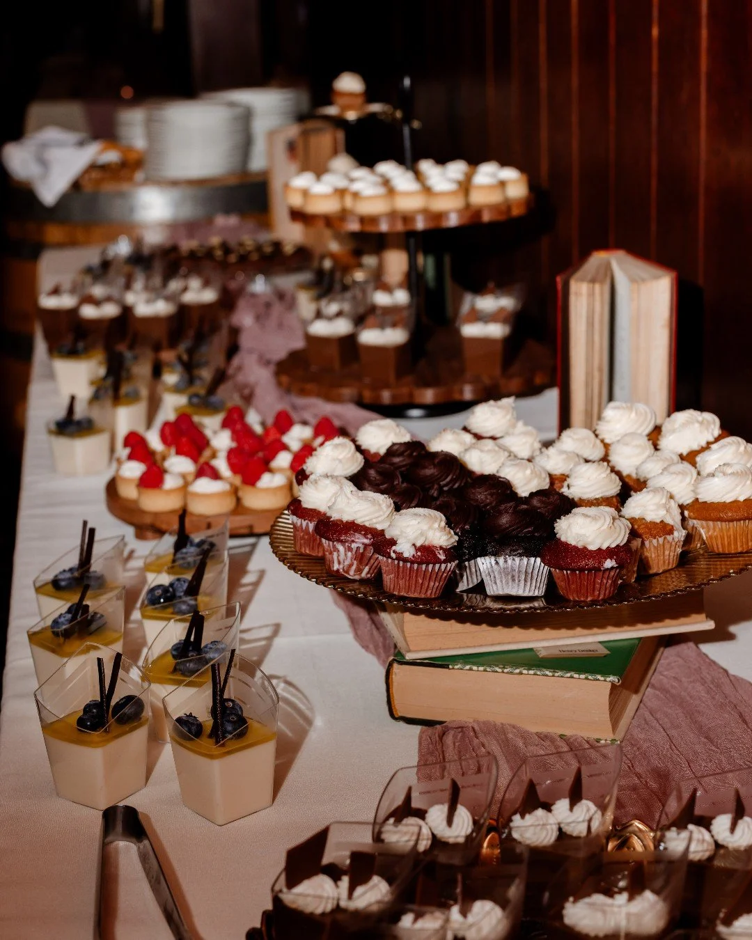 A closer look at the mini patisserie table ✨

Layers of chocolate mousse, fresh fruit tartlets, panna cotta topped with blueberries, and mini cupcakes finished with our signature frosting swirl.

Proof that the dessert table can absolutely steal the 