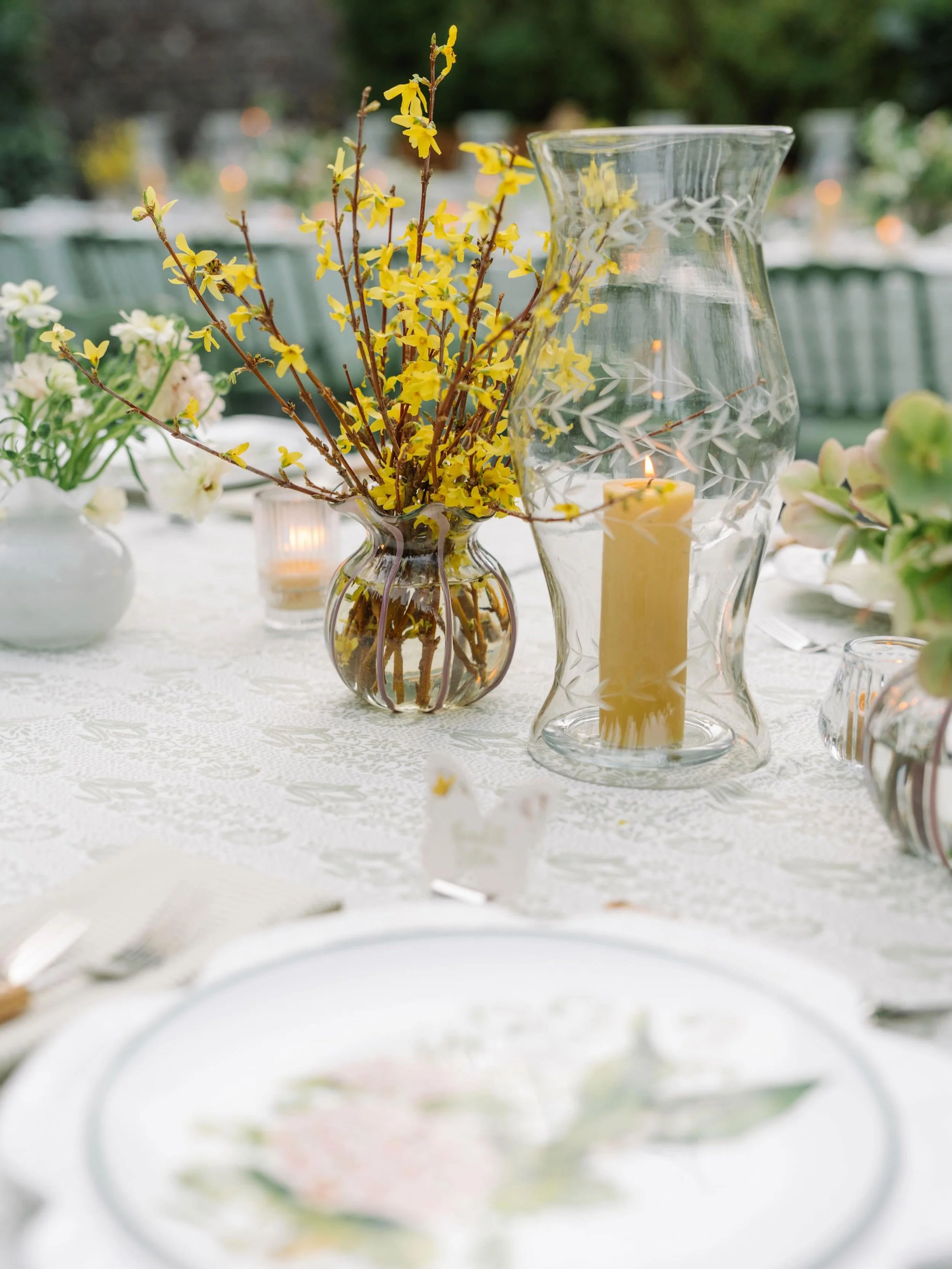 A perfect pairing. We loved seeing our Lavender Stripe Scalloped Vase alongside our 14&rdquo; Clear Wave Etched Hurricanes at this rehearsal dinner. ⁠
⁠
Looking to incorporate unique artisan pieces into your next event? Send us a DM for our latest ne