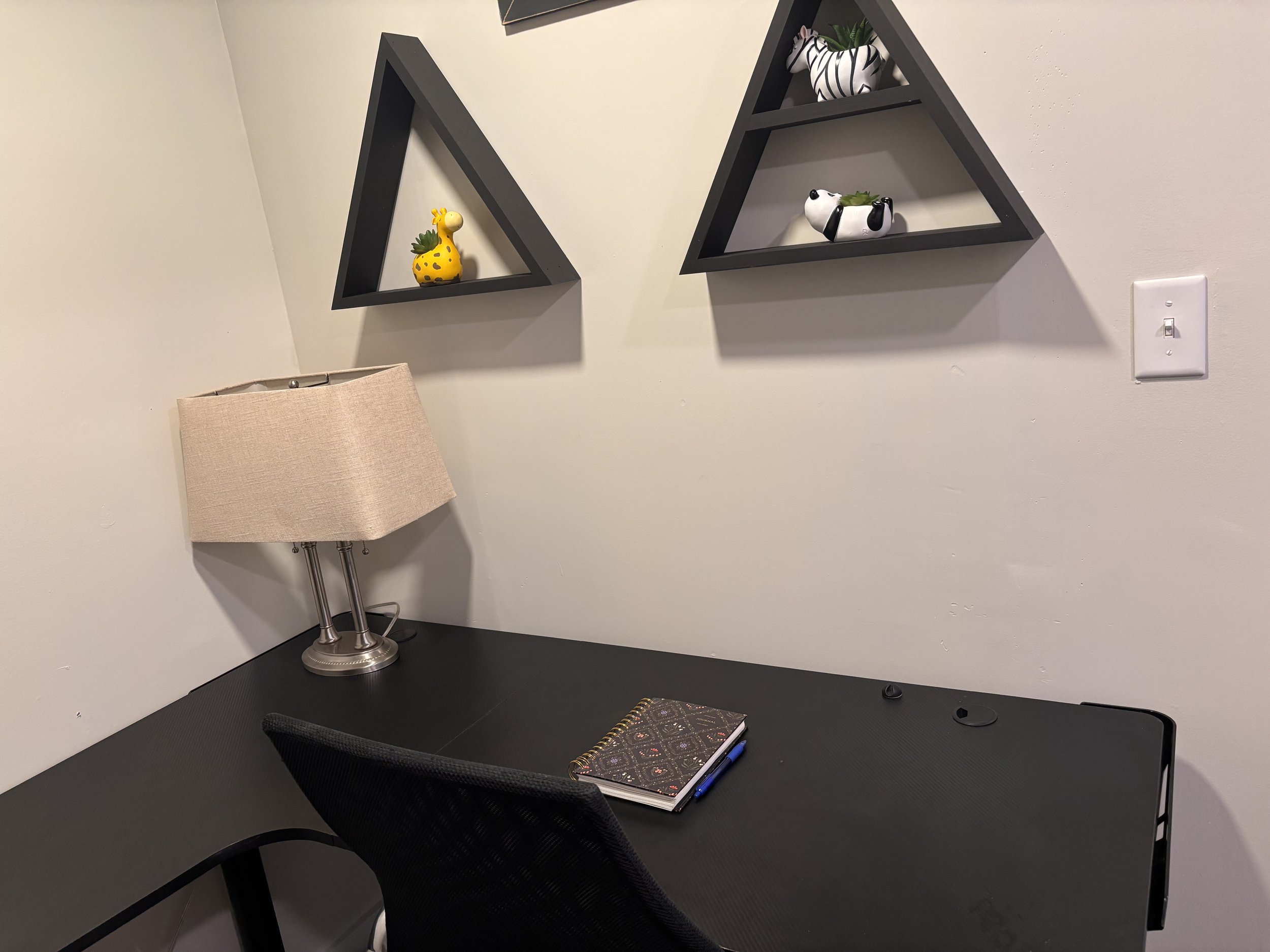 Black Desk with shelves with animal figurines