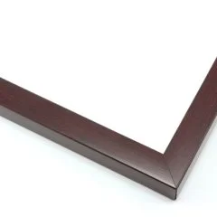 Corner of a brown wood picture frame on white background