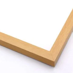 Close-up of a corner of a wooden picture frame with a white background.