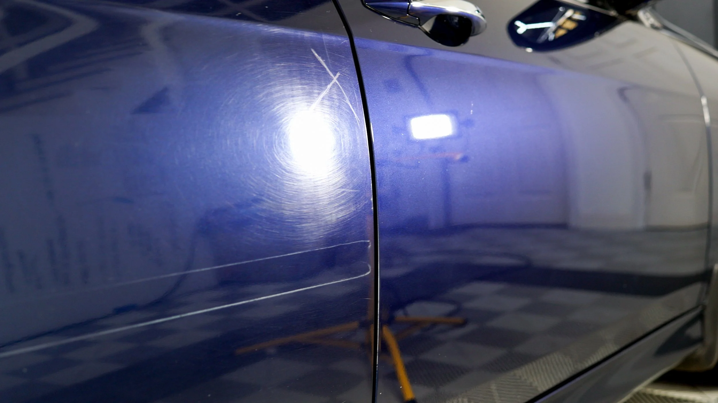 this is a picture of a before and after of paint correction on an acura TSX