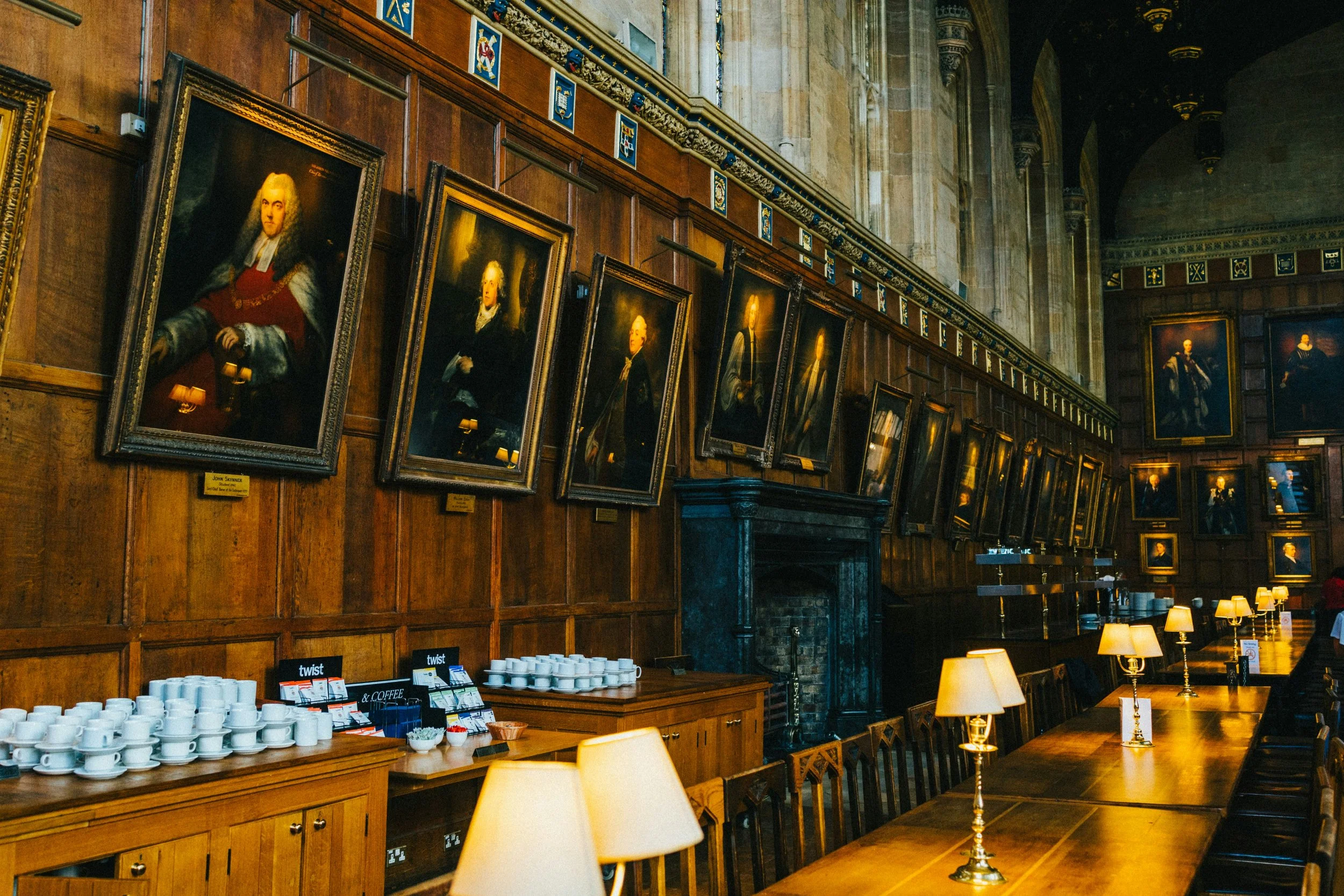 An ancient Oxford college hall on an Art tour of Oxford with wood panels and limestone.