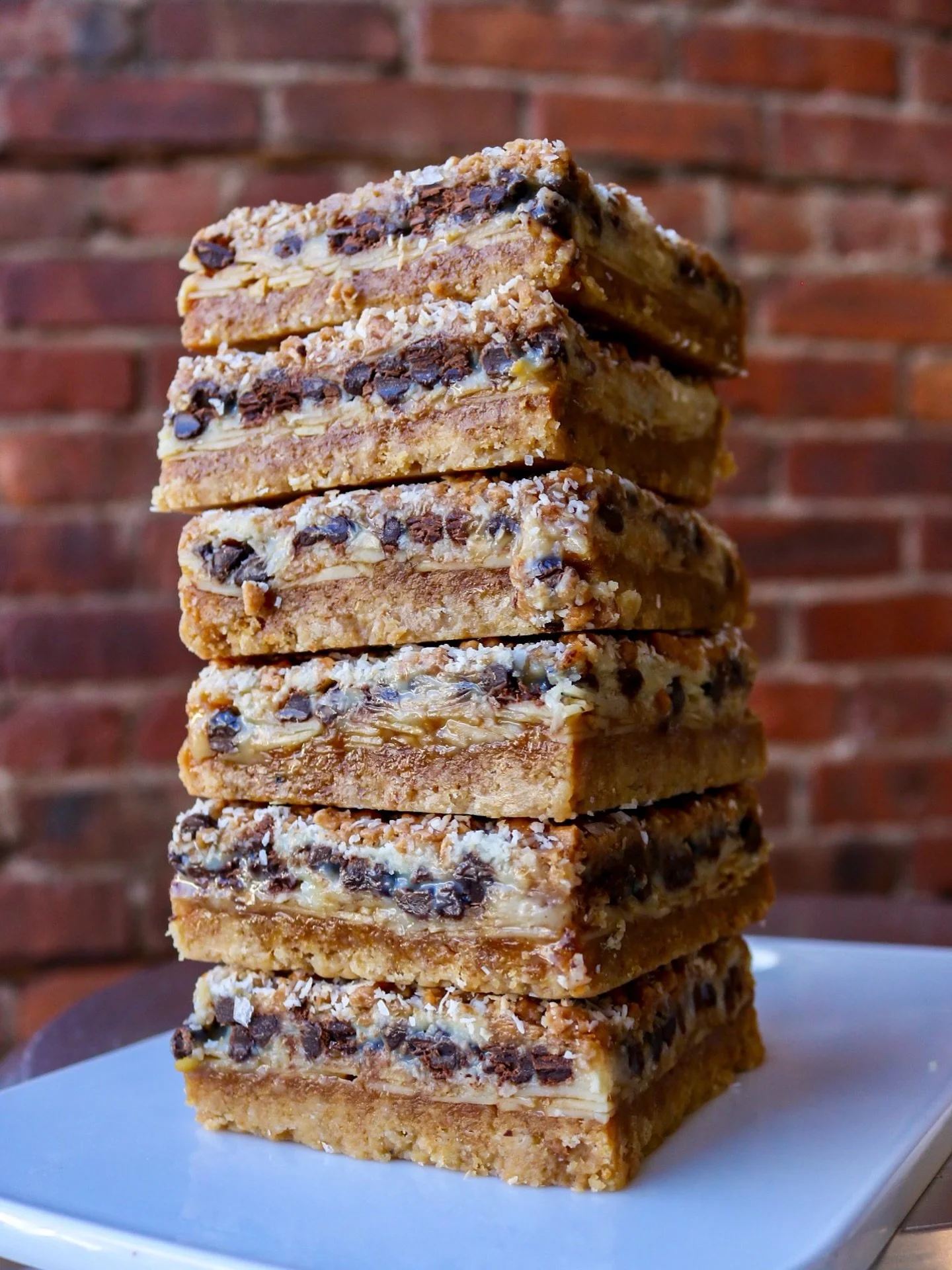 When we say everything, we mean everything. 🍫🥥

The Gooey Everything Bar is stacked with chocolate, toffee, caramel, and coconut, all layered over a buttery, crumbly cookie crust. One bite and you&rsquo;ll understand why we had to bring it back. #t