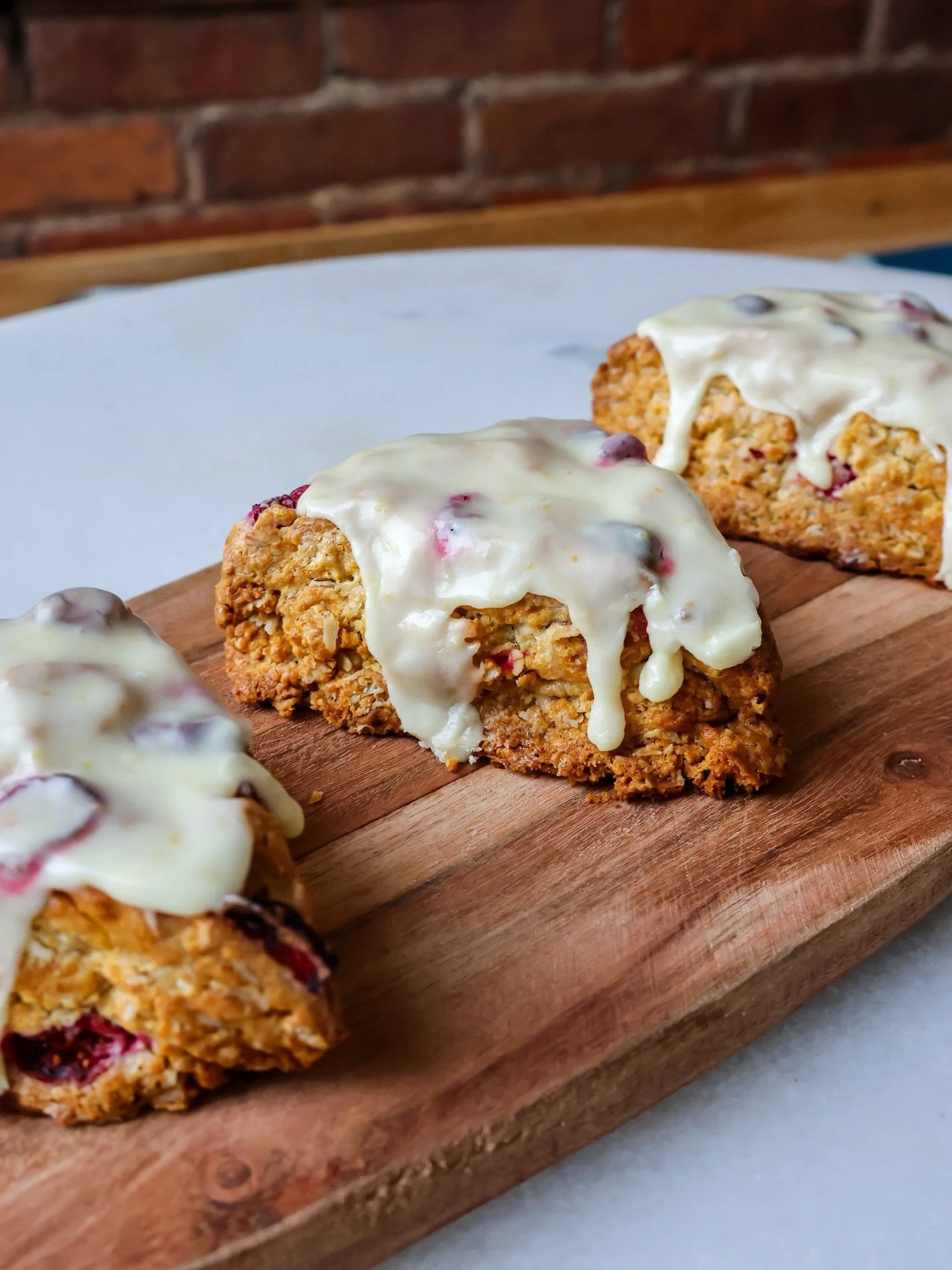 A little brightness for a cold (but sunny!) winter day. 🍊✨ Our Cranberry Orange Scones are buttery, cozy, and just tart enough to wake things up. Perfect with a hot coffee in hand. #thegoodbatch