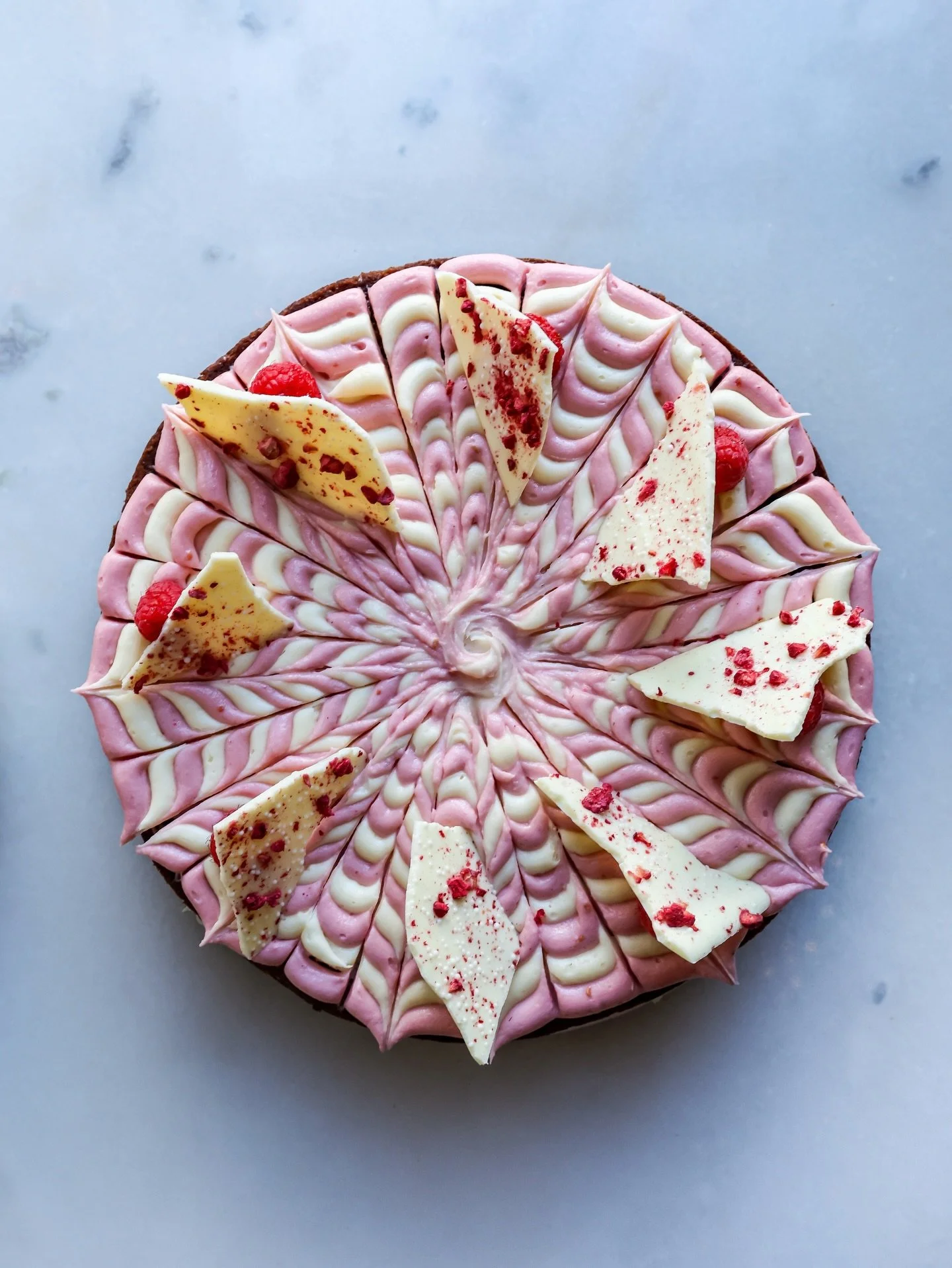 February&rsquo;s Counter Cake is here! ❤️🍰 This gorgeous Red Velvet Cake is layered with decorative cream cheese frosting, raspberry jam, white chocolate raspberry bark, and fresh raspberries.

Available by the slice Friday - Sunday til we sell out.