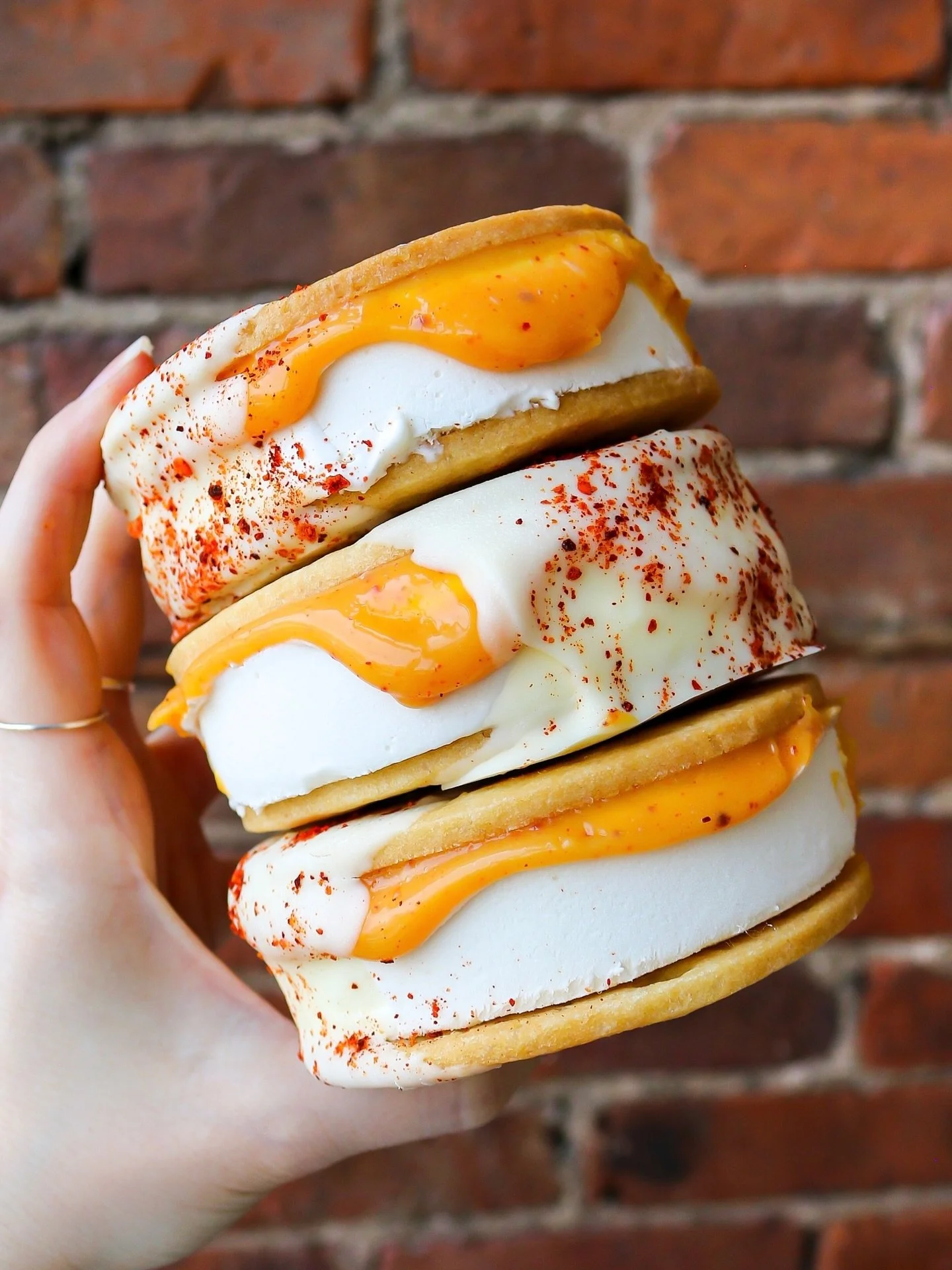 Our Spicy Margarita Ice Cream Sandwich is back! 🌶️ With mezcal-passionfruit margarita curd, brown butter cookies, vanilla ice cream, all dipped in white chocolate and finished with a hit of chili heat. Sweet, spicy, and giving rooftop cocktail energ