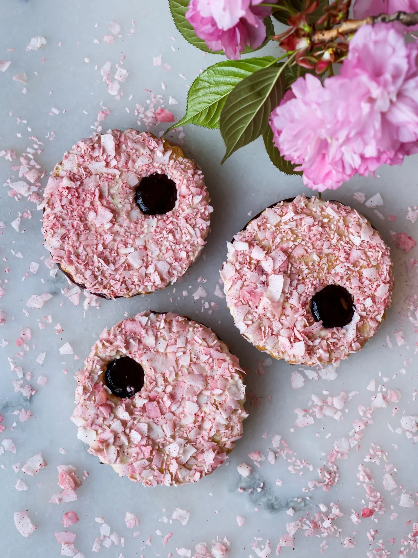 Get it while you still can 🌸✨ Our Cherry Blossom Cookie layers brown butter shortbread with cherryberry jam, white chocolate, and strawberry-tossed coconut - a fresh take on a classic linzer. #thegoodbatch