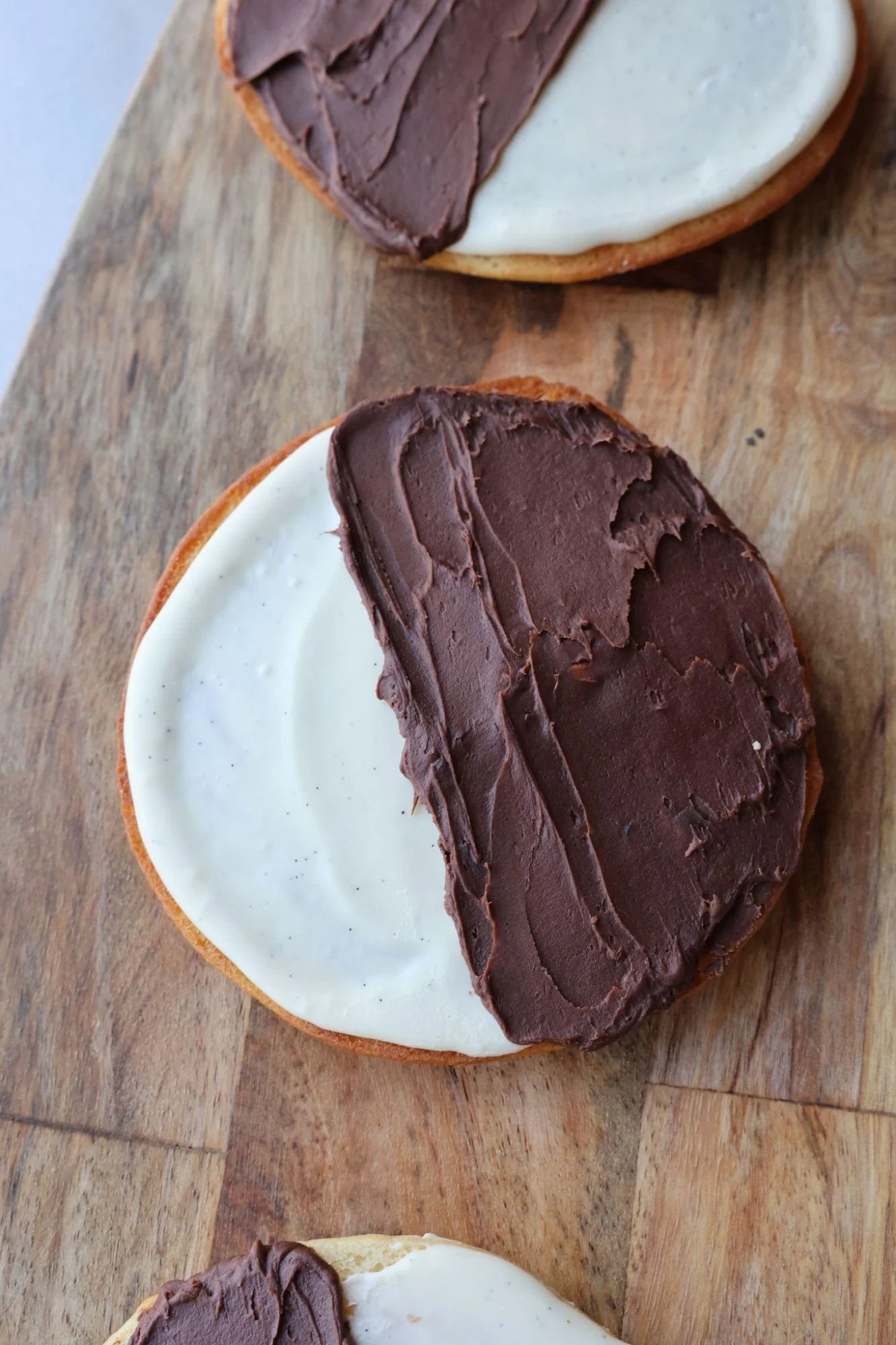 An image of a frosted black and white cookie at The Good Batch Bakery in Brooklyn, New York