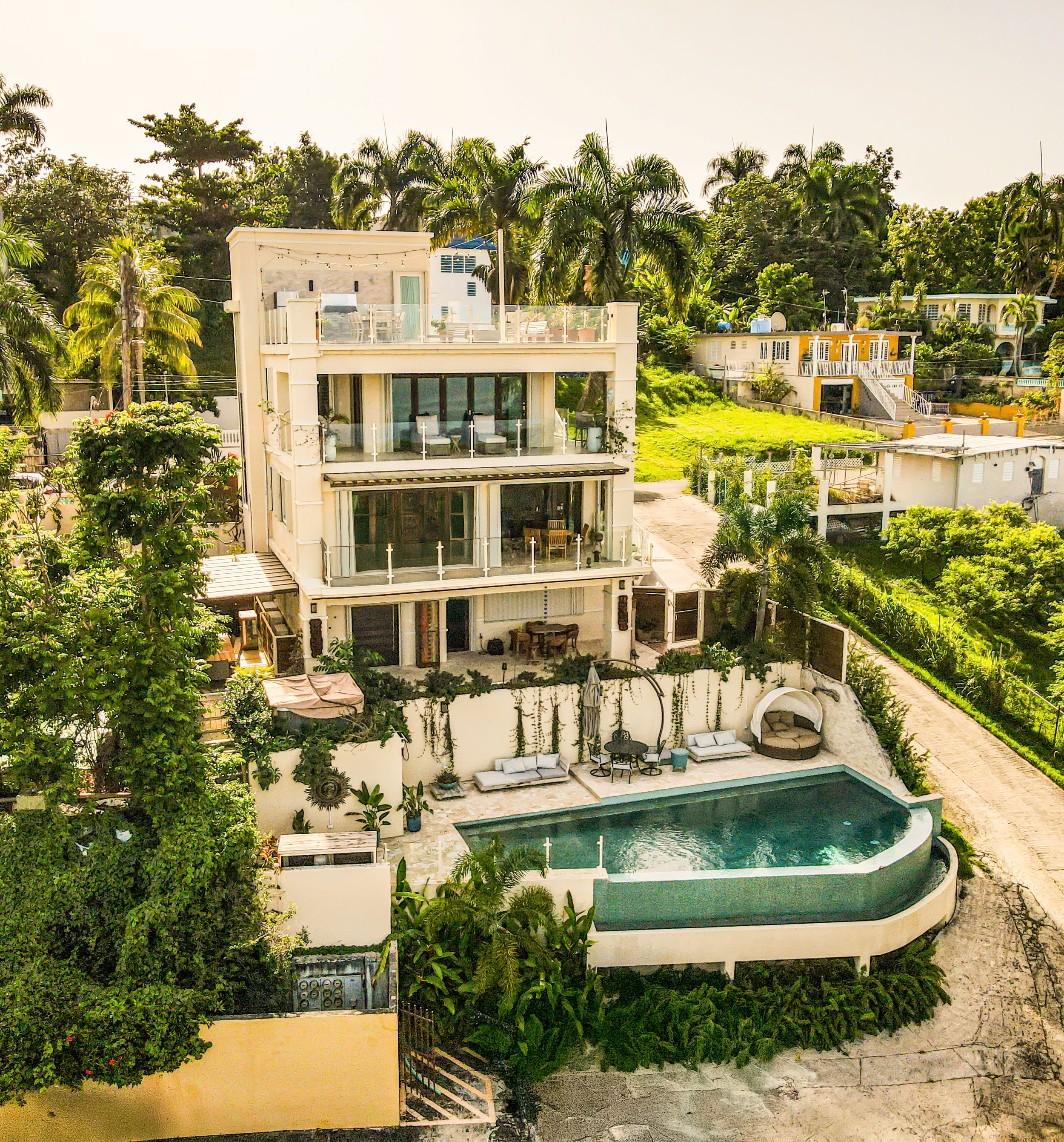 Sirena DEL Faro exterior backyard beautiful landscape 3 floors and a rooftop with oceanview in rincon, pr designed by vampio design inc.jpg