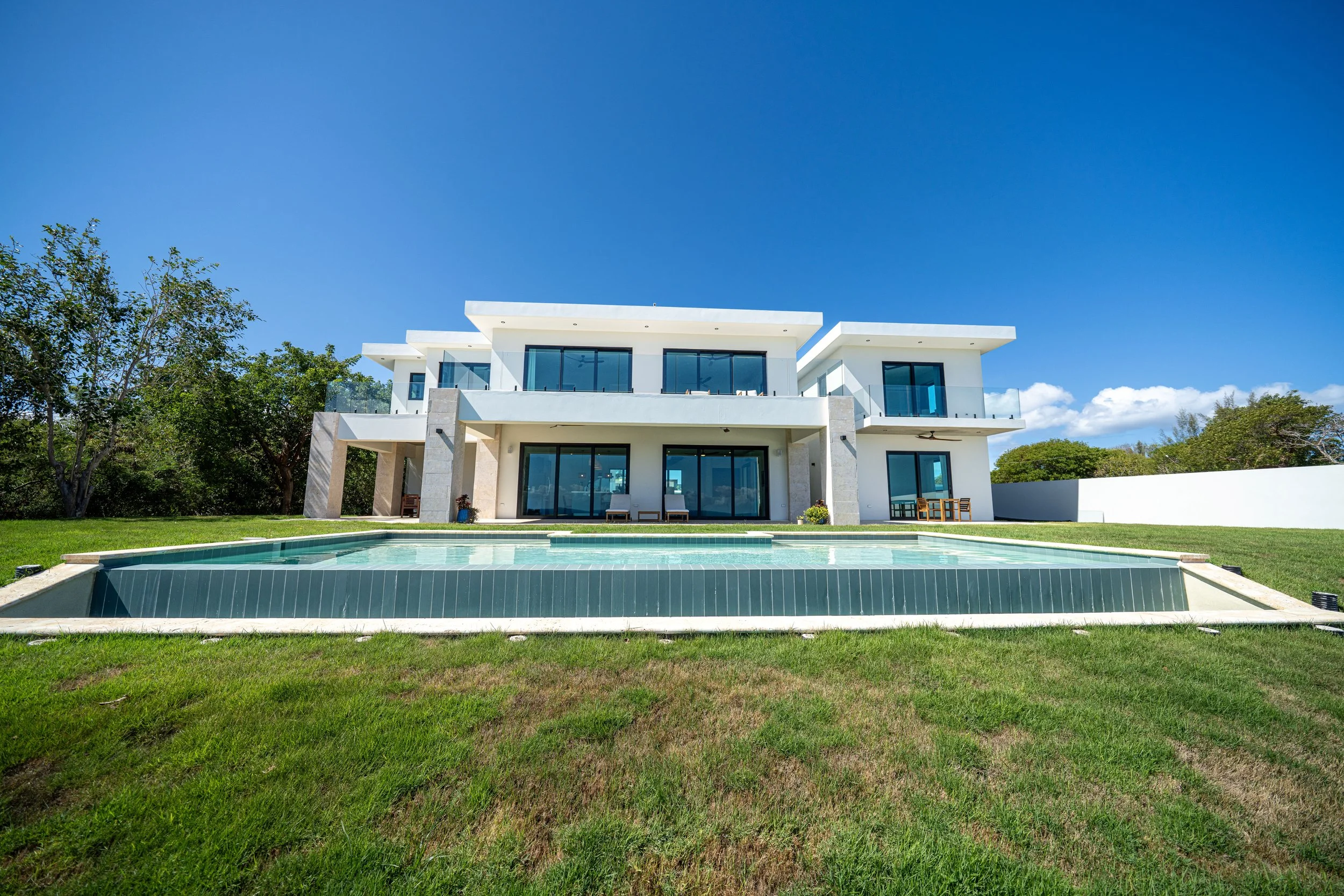 exterior and backyard with infinity pool oceanviews designed by vampio design inc.jpg