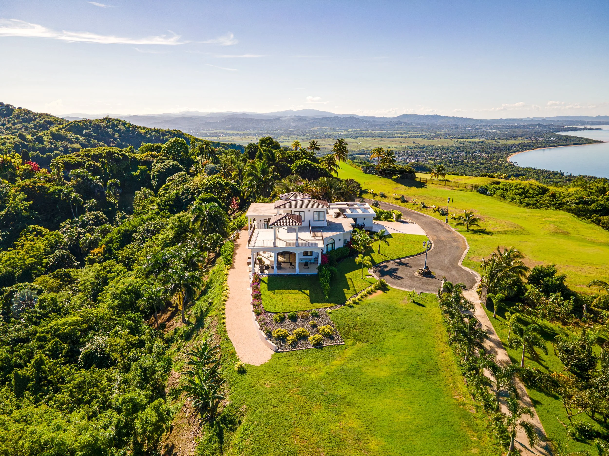 birds eye view drone shot of brand new modern home designed by vampio design inc in rincon, puerto rico.jpg