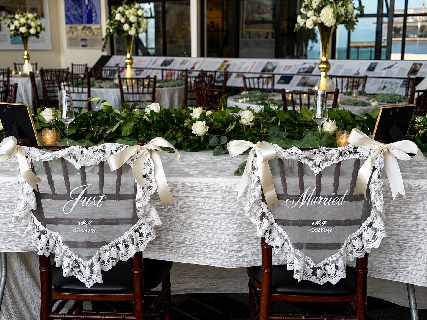 Two seats side by side with 'Just Married' spelled out across them for the married couple to sit at